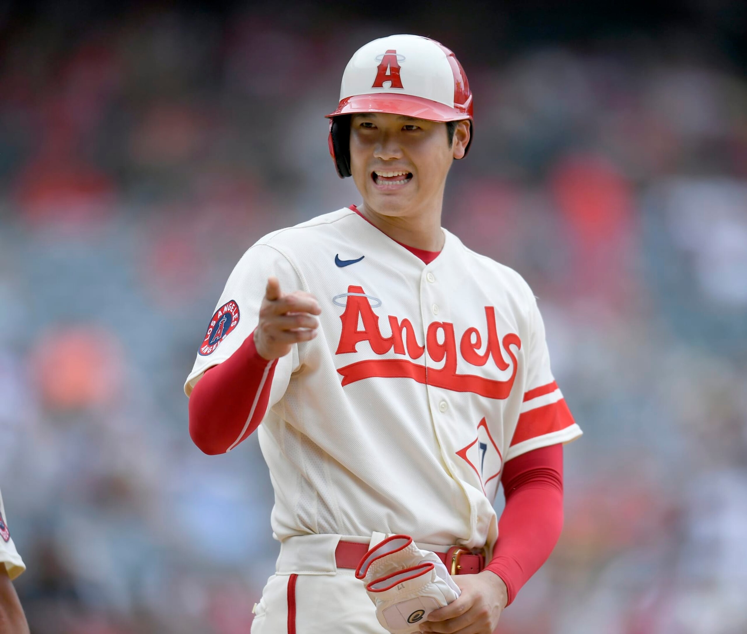 ANAHEIM, CA - AUGUST 04: Shohei Ohtani #17 of the Los Angeles Angels jokes with the Oakland Athletics dugout after he hit a single in the fifth inning at Angel Stadium of Anaheim on August 4, 2022 in Anaheim, California. (Photo by John McCoy/Getty Images)