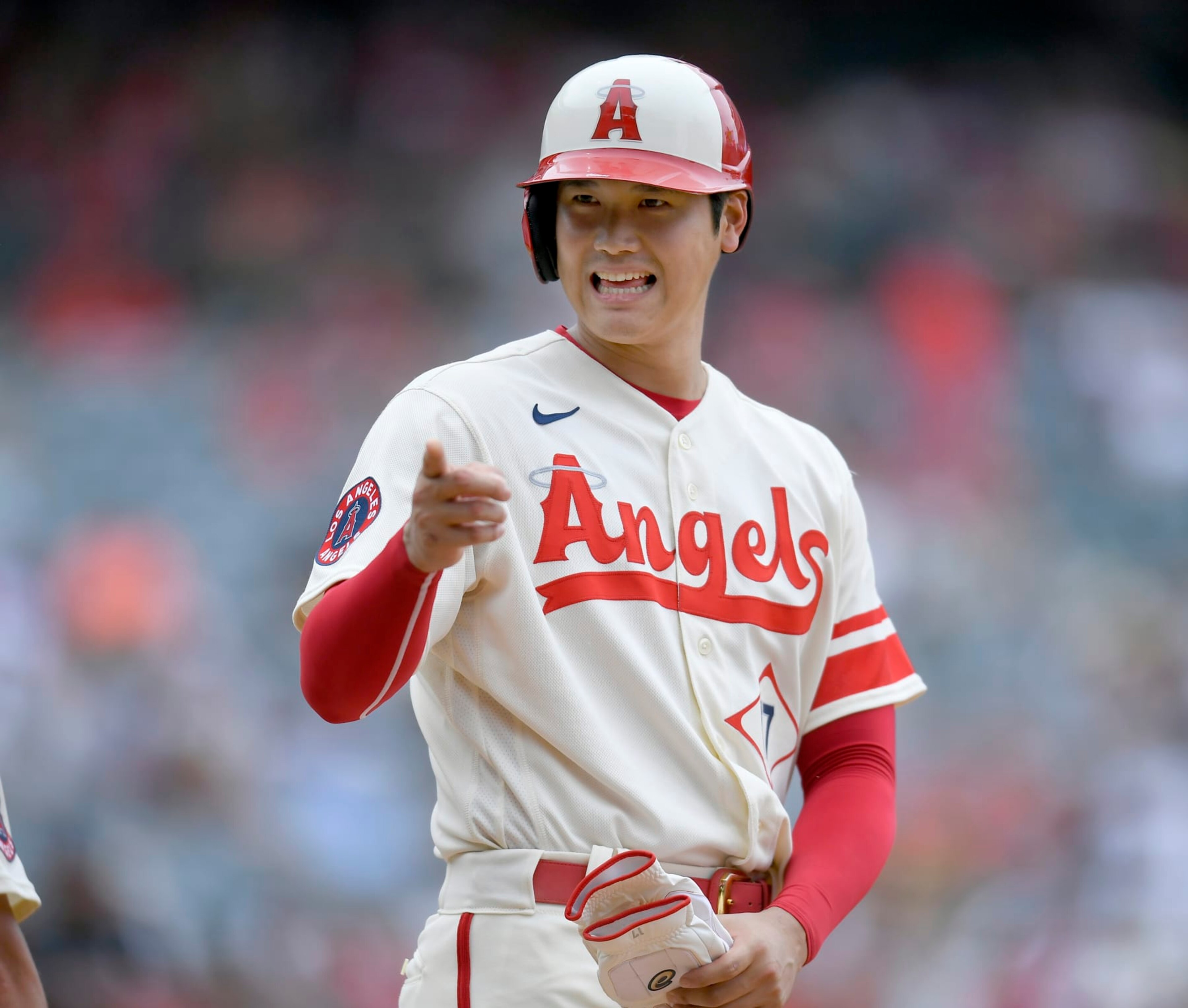 ANAHEIM, CA - AUGUST 04: Shohei Ohtani #17 of the Los Angeles Angels jokes with the Oakland Athletics dugout after he hit a single in the fifth inning at Angel Stadium of Anaheim on August 4, 2022 in Anaheim, California. (Photo by John McCoy/Getty Images)