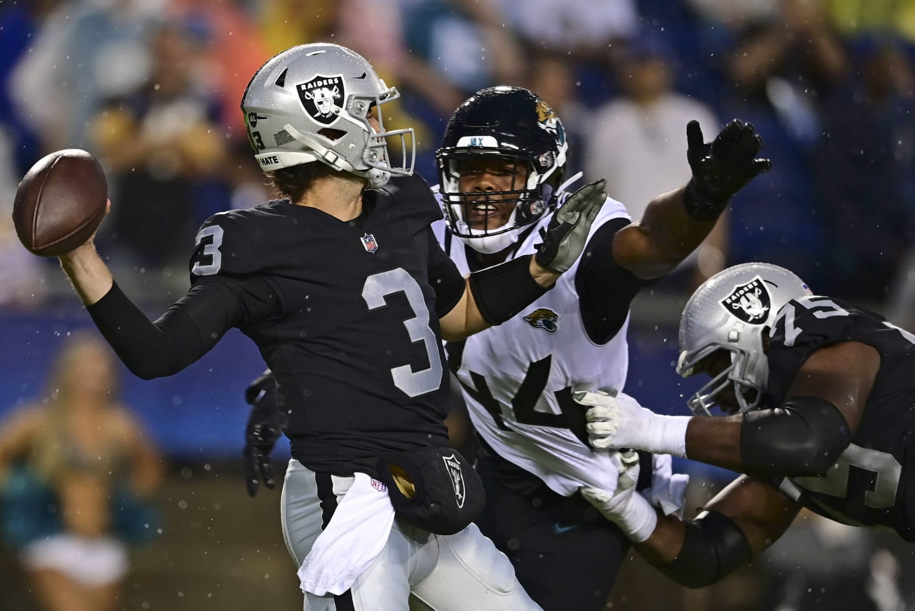 Las Vegas Raiders quarterback Jarrett Stidham (3) throws a pass under pressure from Jacksonville Jaguars linebacker Travon Walker (44) during the first half of the NFL football Hall of Fame Game exhibition Thursday, Aug. 4, 2022, in Canton, Ohio. (AP Photo/David Dermer) Las Vegas Raiders quarterback Jarrett Stidham (3) throws a pass under pressure from Jacksonville Jaguars linebacker Travon Walker (44) during the first half of the NFL football Hall of Fame Game exhibition Thursday, Aug. 4, 2022, in Canton, Ohio. (AP Photo/David Dermer)