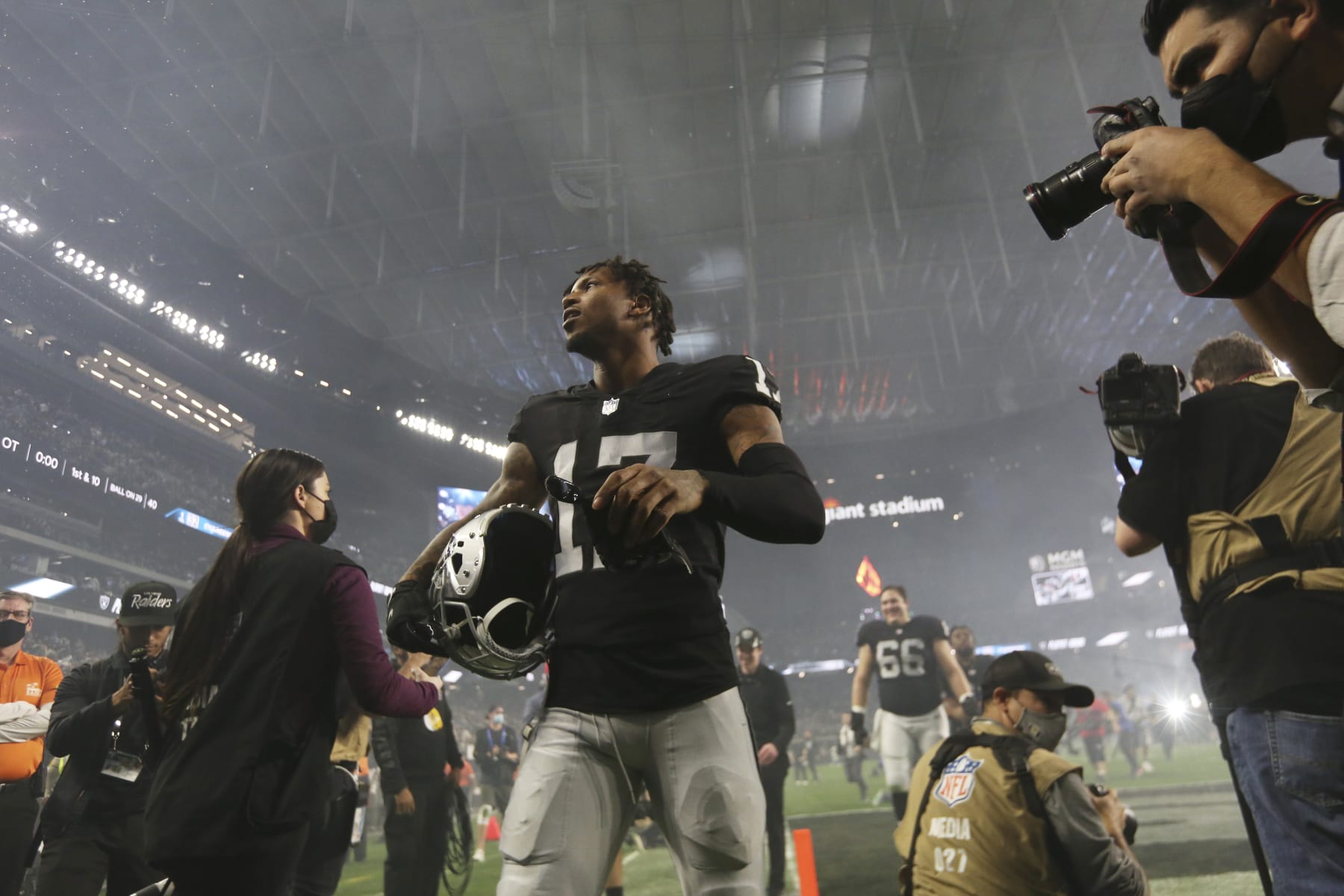 Las Vegas Raiders' Tyron Johnson (17) walks off the field after the Las Vegas Raiders defeated the Los Angeles Chargers in overtime of an NFL football game, Sunday, Jan. 9, 2022, in Las Vegas. (AP Photo/Ellen Schmidt) Las Vegas Raiders' Tyron Johnson (17) walks off the field after the Las Vegas Raiders defeated the Los Angeles Chargers in overtime of an NFL football game, Sunday, Jan. 9, 2022, in Las Vegas. (AP Photo/Ellen Schmidt)