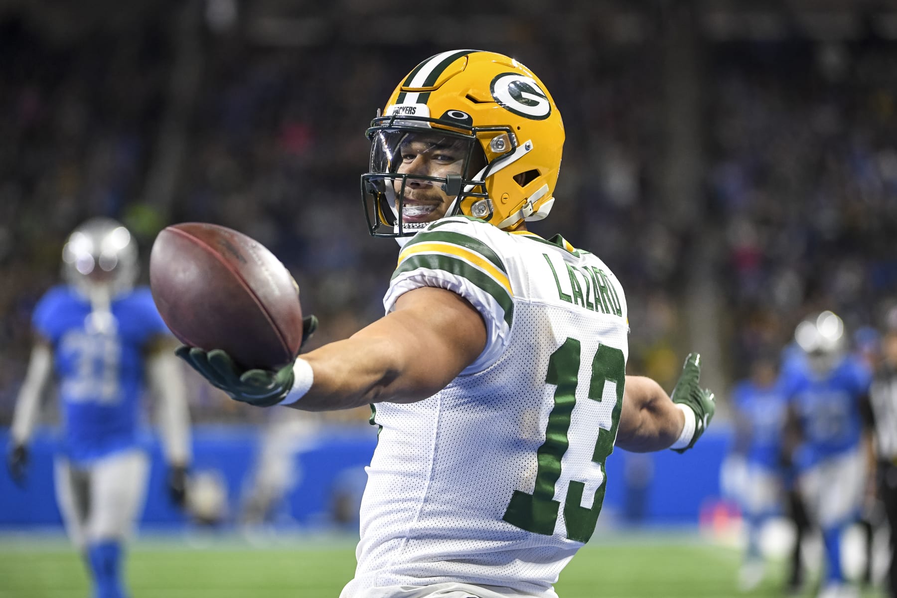 DETROIT, MICHIGAN - JANUARY 09: Allen Lazard #13 of the Green Bay Packers celebrates after catching a touchdown pass during the second quarter against the Detroit Lions at Ford Field on January 09, 2022 in Detroit, Michigan. (Photo by Nic Antaya/Getty Images)"n