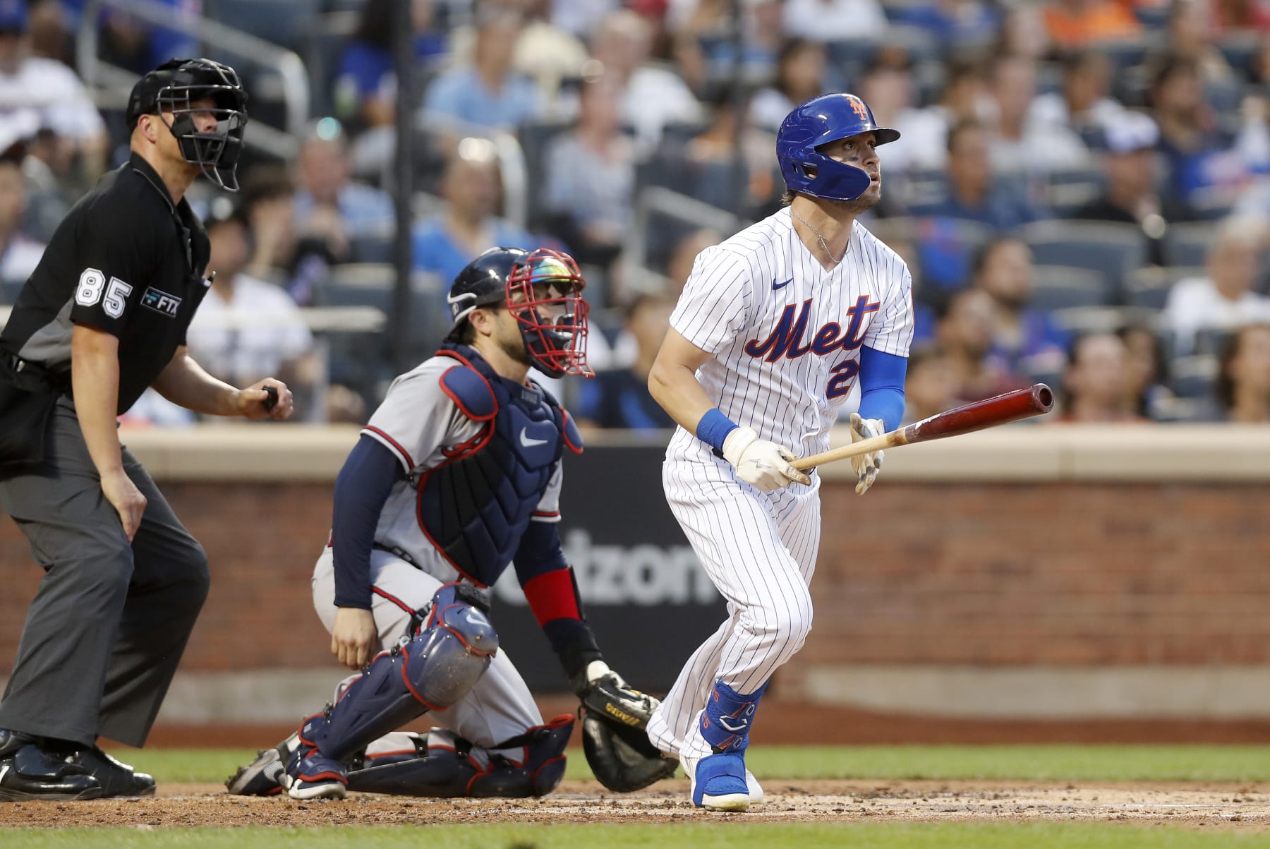 NEW YORK, NEW YORK - AUGUST 04:  Tyler Naquin #25 of the New York Mets follows through on his second inning home run against the Atlanta Braves at Citi Field on August 04, 2022 in New York City. The Mets defeated the Braves 6-4. (Photo by Jim McIsaac/Getty Images)