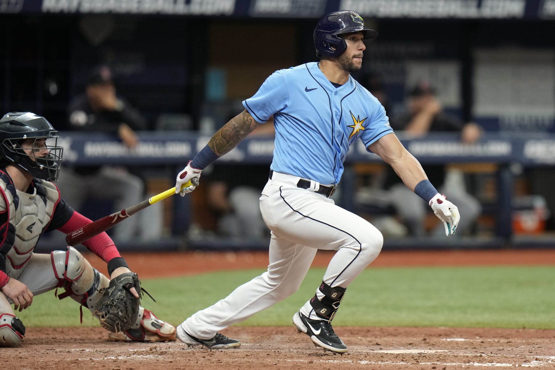 Tampa Bay Rays' David Peralta watches his single off Cleveland Guardians relief pitcher Trevor Stephan during the eighth inning of a baseball game Sunday, July 31, 2022, in St. Petersburg, Fla. (AP Photo/Chris O'Meara)