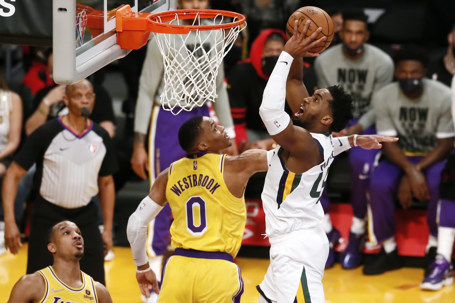 LOS ANGELES, CA - JANUARY 17: Donovan Mitchell #45 of the Utah Jazz shoots the ball against Russell Westbrook #0 of the Los Angeles Lakers during a game at the Crypto.com Arena on January 17, 2022 in Los Angeles, California. NOTE TO USER: User expressly acknowledges and agrees that, by downloading and or using this photograph, User is consenting to the terms and conditions of the Getty Images License Agreement. Mandatory Credit: 2022 NBAE (Photo by Chris Elise/NBAE via Getty Images)