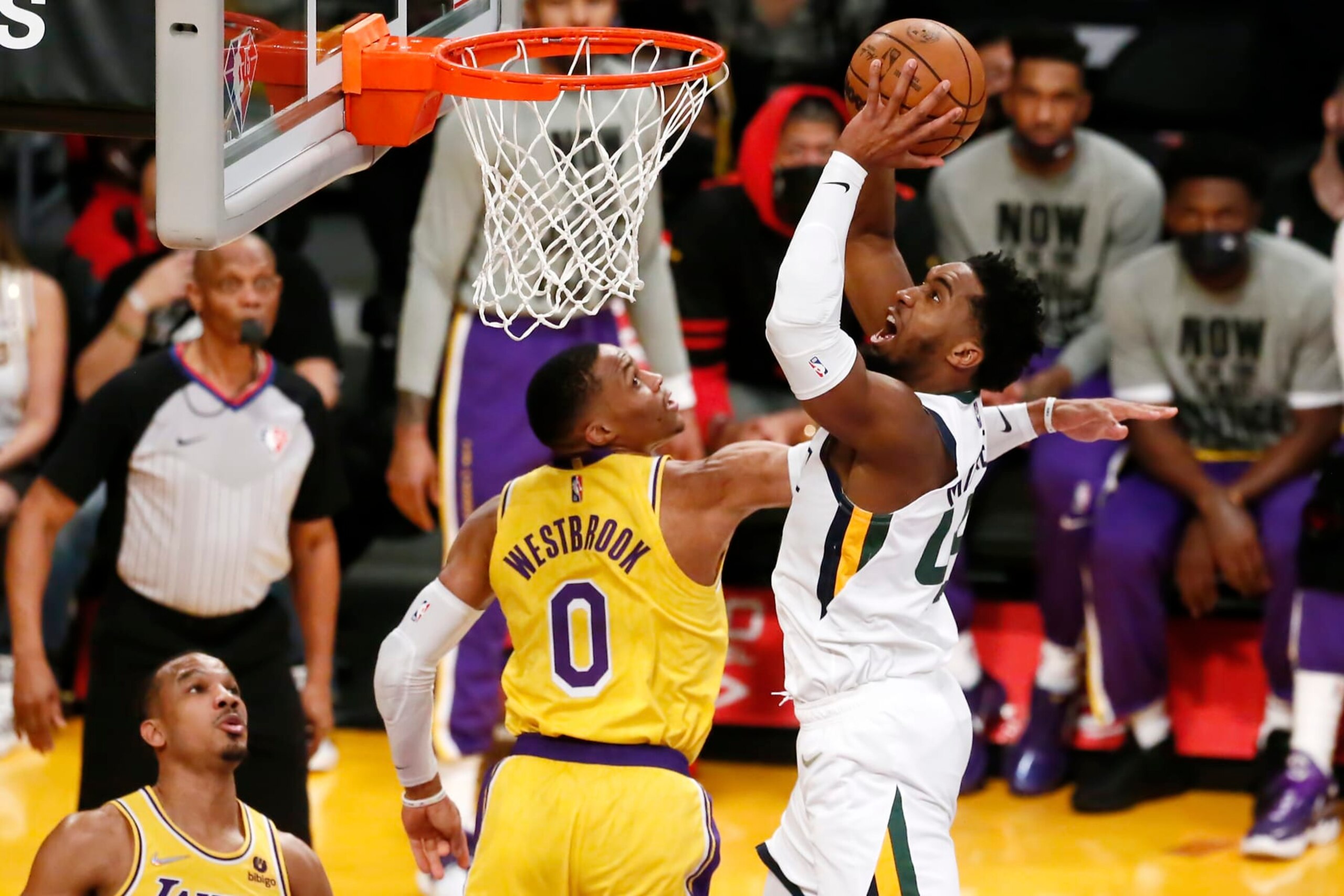LOS ANGELES, CA - JANUARY 17: Donovan Mitchell #45 of the Utah Jazz shoots the ball against Russell Westbrook #0 of the Los Angeles Lakers during a game at the Crypto.com Arena on January 17, 2022 in Los Angeles, California. NOTE TO USER: User expressly acknowledges and agrees that, by downloading and or using this photograph, User is consenting to the terms and conditions of the Getty Images License Agreement. Mandatory Credit: 2022 NBAE (Photo by Chris Elise/NBAE via Getty Images)