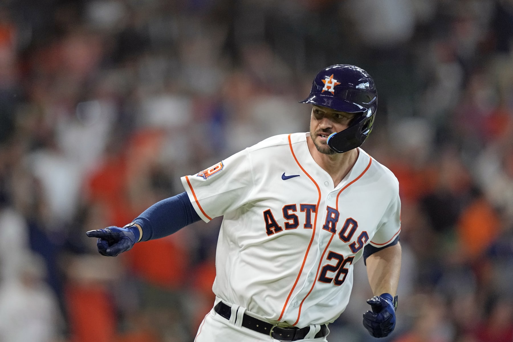 Houston Astros' Trey Mancini celebrates after hitting a two-run home run against the Boston Red Sox during the second inning of a baseball game Wednesday, Aug. 3, 2022, in Houston. (AP Photo/David J. Phillip)