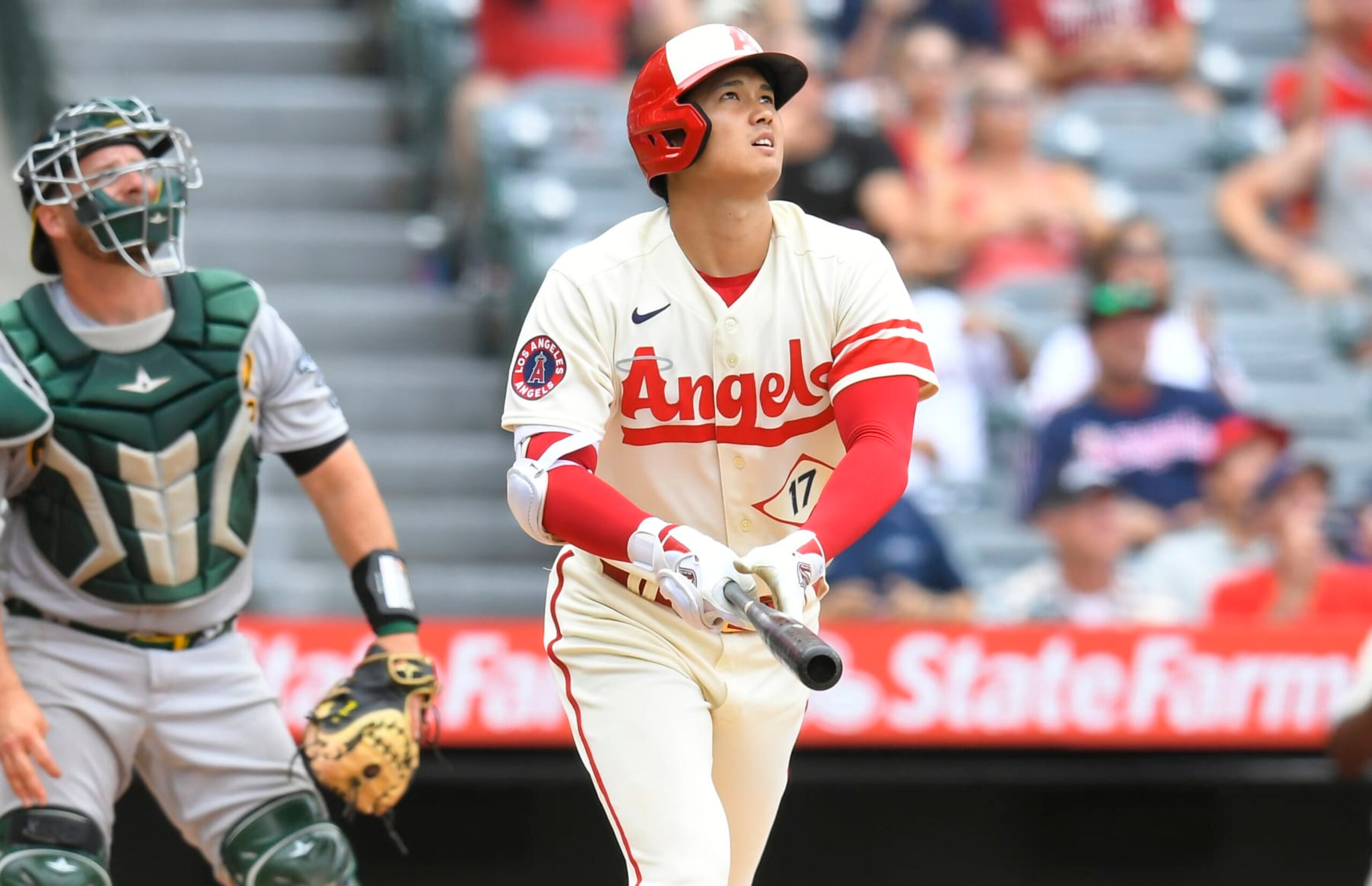 ANAHEIM, CA - AUGUST 04: Stephen Vogt #21 of the Oakland Athletics looks on as Shohei Ohtani #17 of the Los Angeles Angels watches his home run leave the park in the seventh inning at Angel Stadium of Anaheim on August 4, 2022 in Anaheim, California. (Photo by John McCoy/Getty Images)