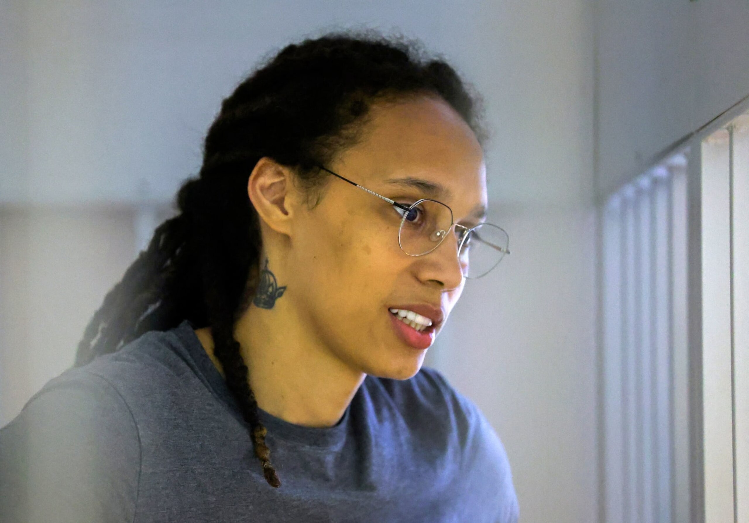 US Women's National Basketball Association (WNBA) basketball player Brittney Griner, who was detained at Moscow's Sheremetyevo airport and later charged with illegal possession of cannabis, waits for the verdict inside a defendants' cage during a hearing in Khimki outside Moscow, on August 4, 2022. - A Russian court found Griner guilty of smuggling and storing narcotics after prosecutors requested a sentence of nine and a half years in jail for the athlete. (Photo by EVGENIA NOVOZHENINA / POOL / AFP) (Photo by EVGENIA NOVOZHENINA/POOL/AFP via Getty Images)