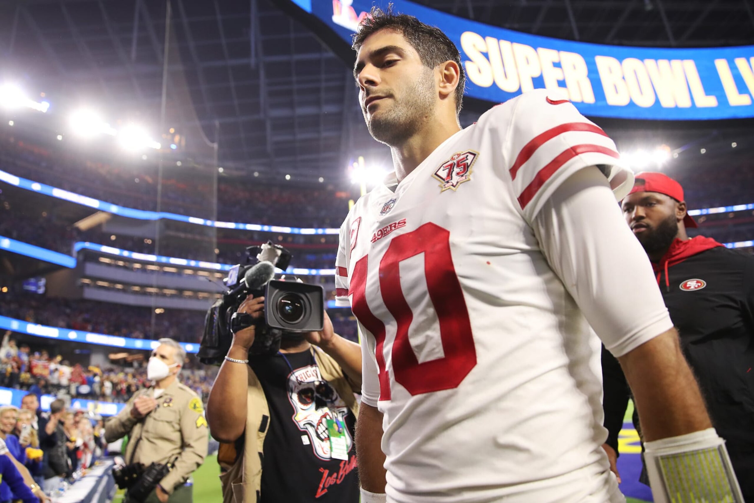 INGLEWOOD, CALIFORNIA - JANUARY 30: Jimmy Garoppolo #10 of the San Francisco 49ers walks off the field after being defeated by the Los Angeles Rams in the NFC Championship Game at SoFi Stadium on January 30, 2022 in Inglewood, California. The Rams defeated the 49ers 20-17. (Photo by Christian Petersen/Getty Images)