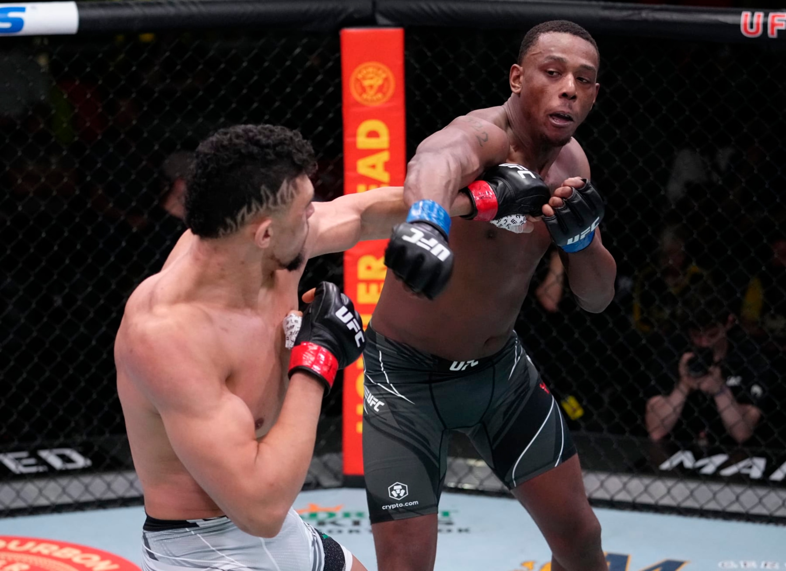 LAS VEGAS, NEVADA - FEBRUARY 19: (R-L) Jamahal Hill and Johnny Walker of Brazil trade punches in their light heavyweight fight during the UFC Fight Night event at UFC APEX on February 19, 2022 in Las Vegas, Nevada. (Photo by Jeff Bottari/Zuffa LLC)