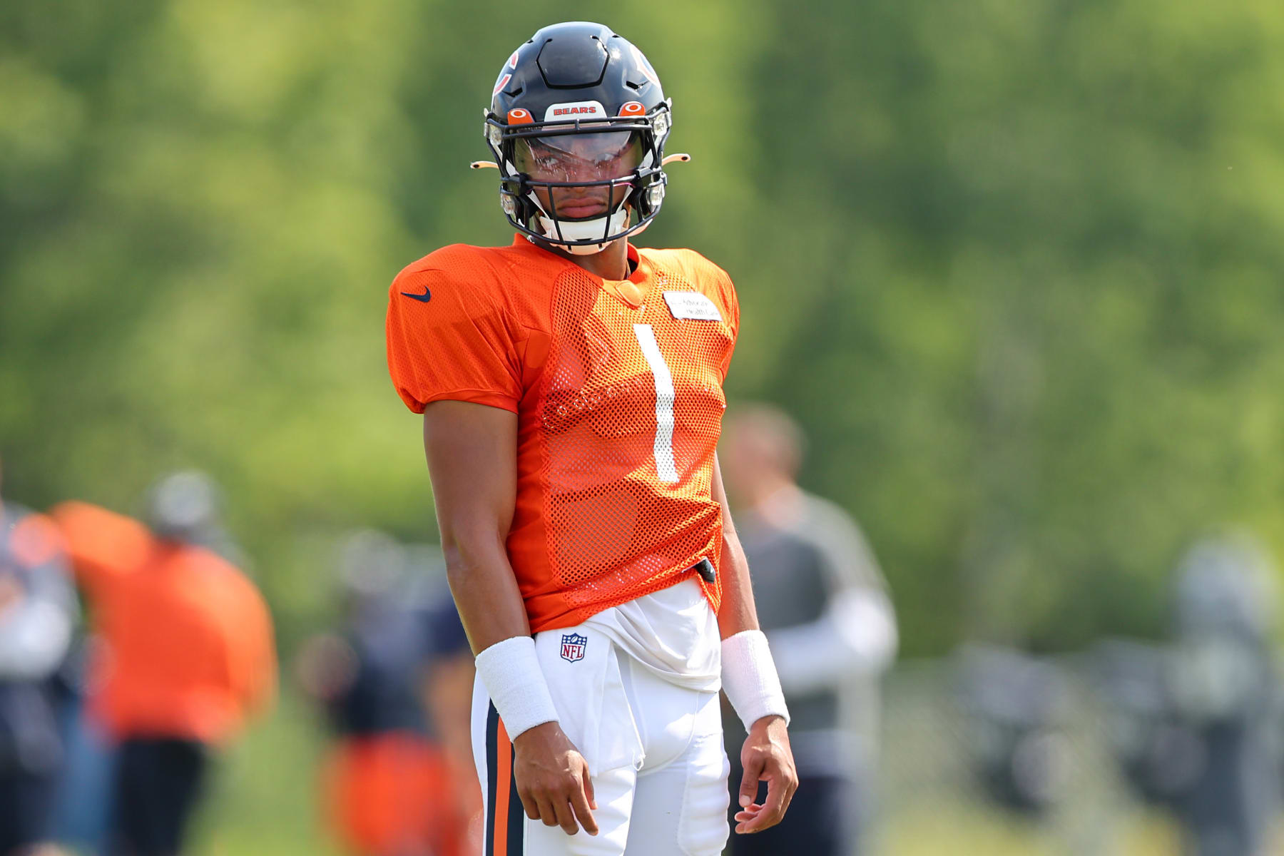 LAKE FOREST, ILLINOIS - AUGUST 02: Justin Fields #1 of the Chicago Bears takes part in a drill during training camp at the PNC Center at Halas Hall on August 02, 2022 in Lake Forest, Illinois. (Photo by Michael Reaves/Getty Images)