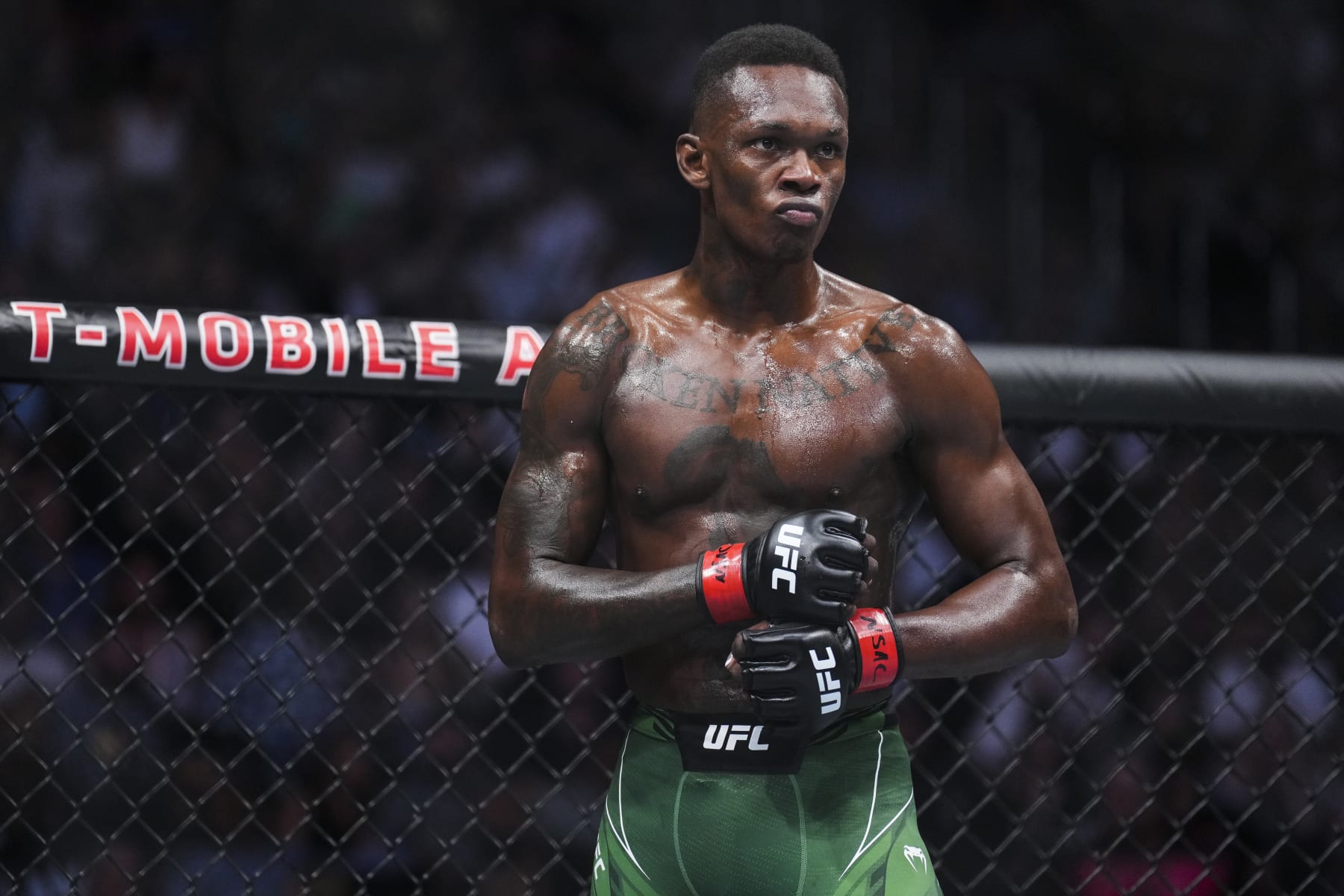 LAS VEGAS, NEVADA - JULY 02: Israel Adesanya of Nigeria awaits the start of the round in the UFC middleweight championship fight during the UFC 276 event at T-Mobile Arena on July 02, 2022 in Las Vegas, Nevada. (Photo by Chris Unger/Zuffa LLC)