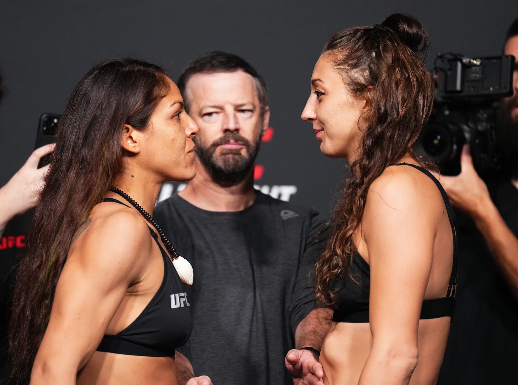 LAS VEGAS, NEVADA - AUGUST 05: (L-R) Opponents Brogan Walker and Juliana Miller face off during the UFC Fight Night weigh-in at UFC APEX on August 05, 2022 in Las Vegas, Nevada. (Photo by Chris Unger/Zuffa LLC)