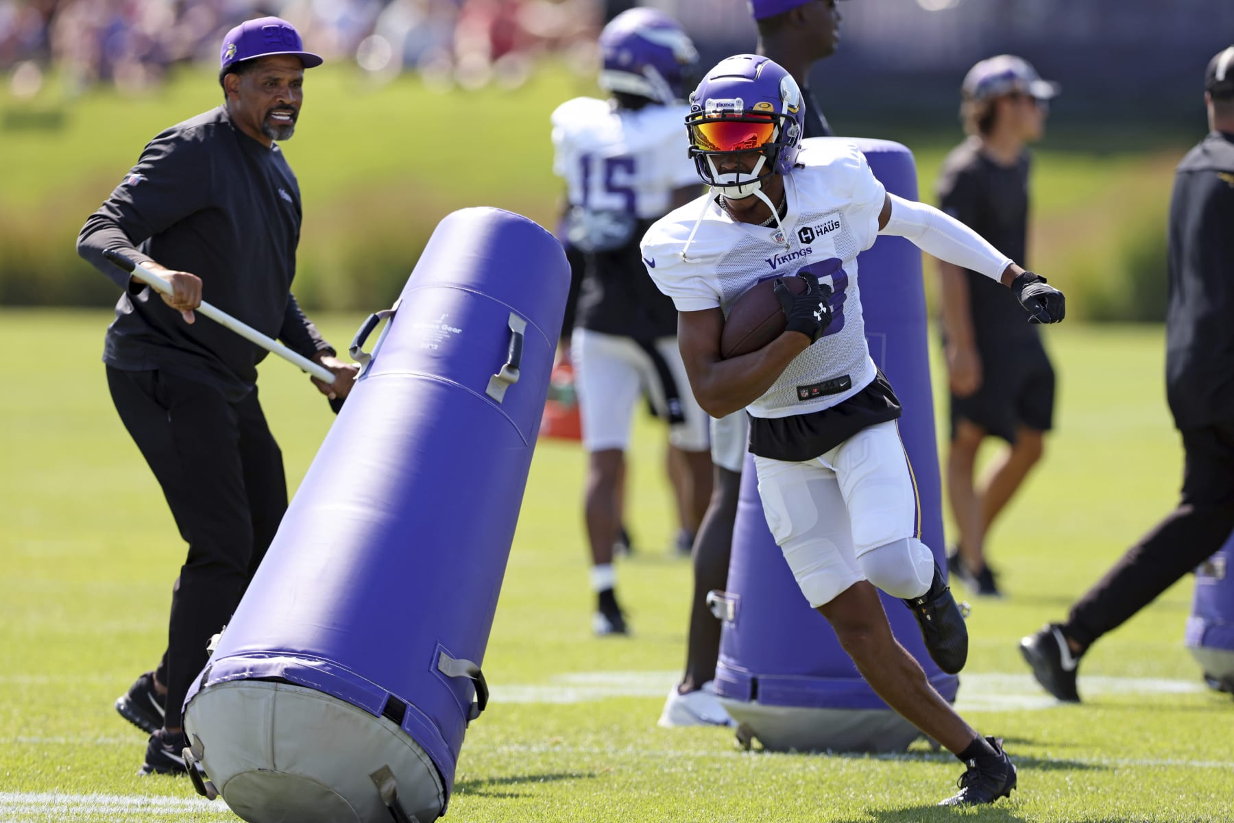 Minnesota Vikings wide receiver Justin Jefferson (18) takes part in the drills at the NFL football team's practice facility in Eagan, Minn., Friday, Aug. 5, 2022. (AP Photo/Stacy Bengs)