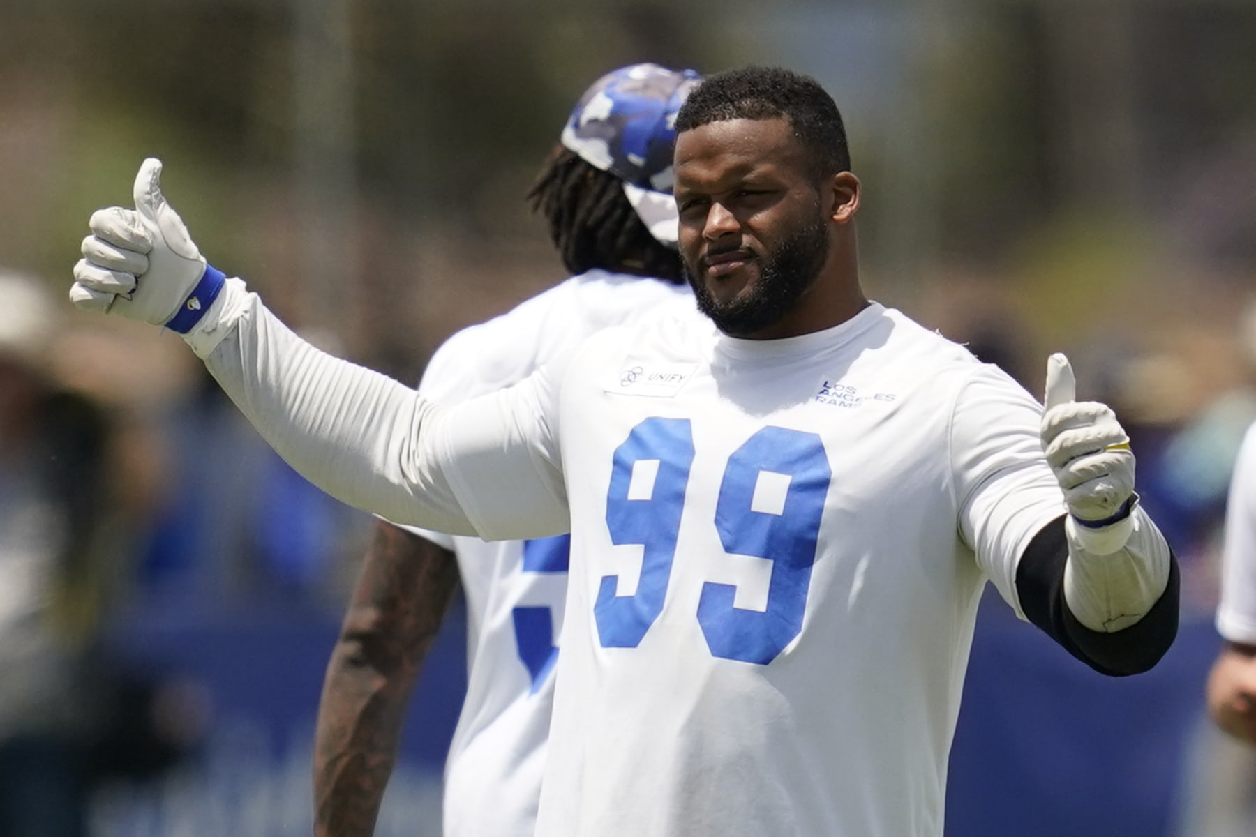 Los Angeles Rams defensive tackle Aaron Donald (99) participates in drills at the NFL football team's practice facility in Irvine, Calif. Friday, July 29, 2022. (AP Photo/Ashley Landis)