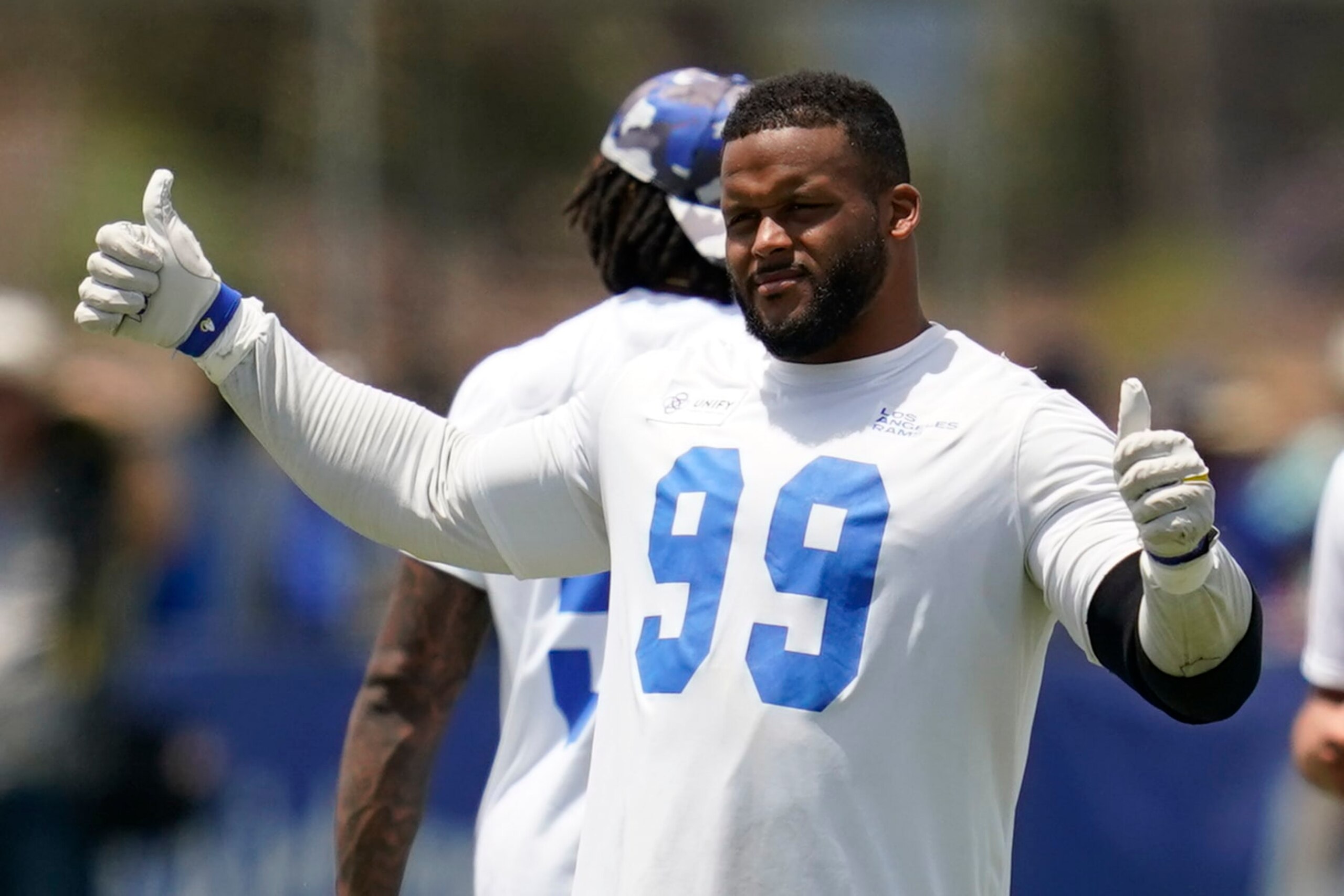 Los Angeles Rams defensive tackle Aaron Donald (99) participates in drills at the NFL football team's practice facility in Irvine, Calif. Friday, July 29, 2022. (AP Photo/Ashley Landis)