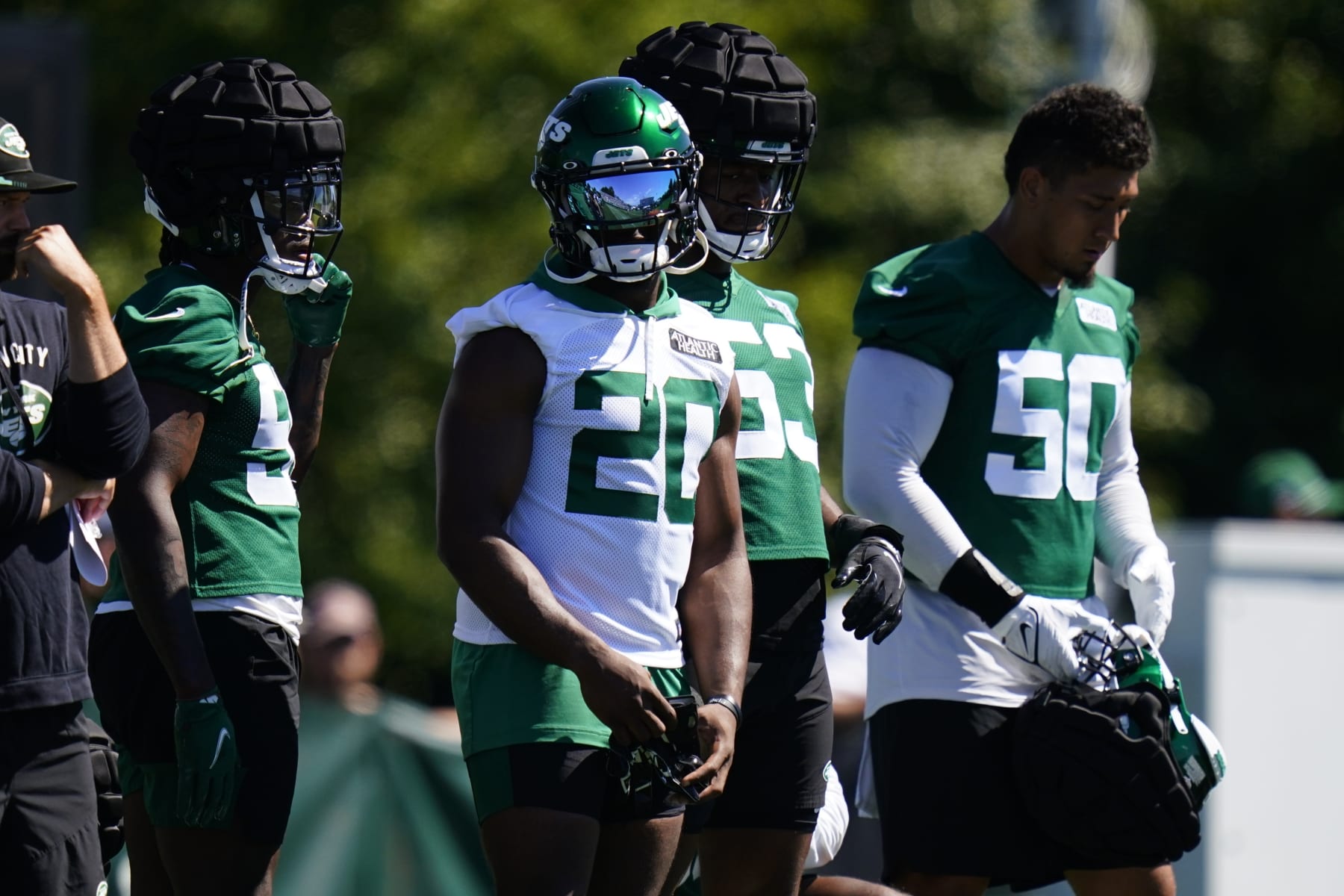 New York Jets' Breece Hall (20) stands with teammates during drills at the NFL football team's practice facility Saturday, July 30, 2022, in Florham Park, N.J. (AP Photo/Frank Franklin II)