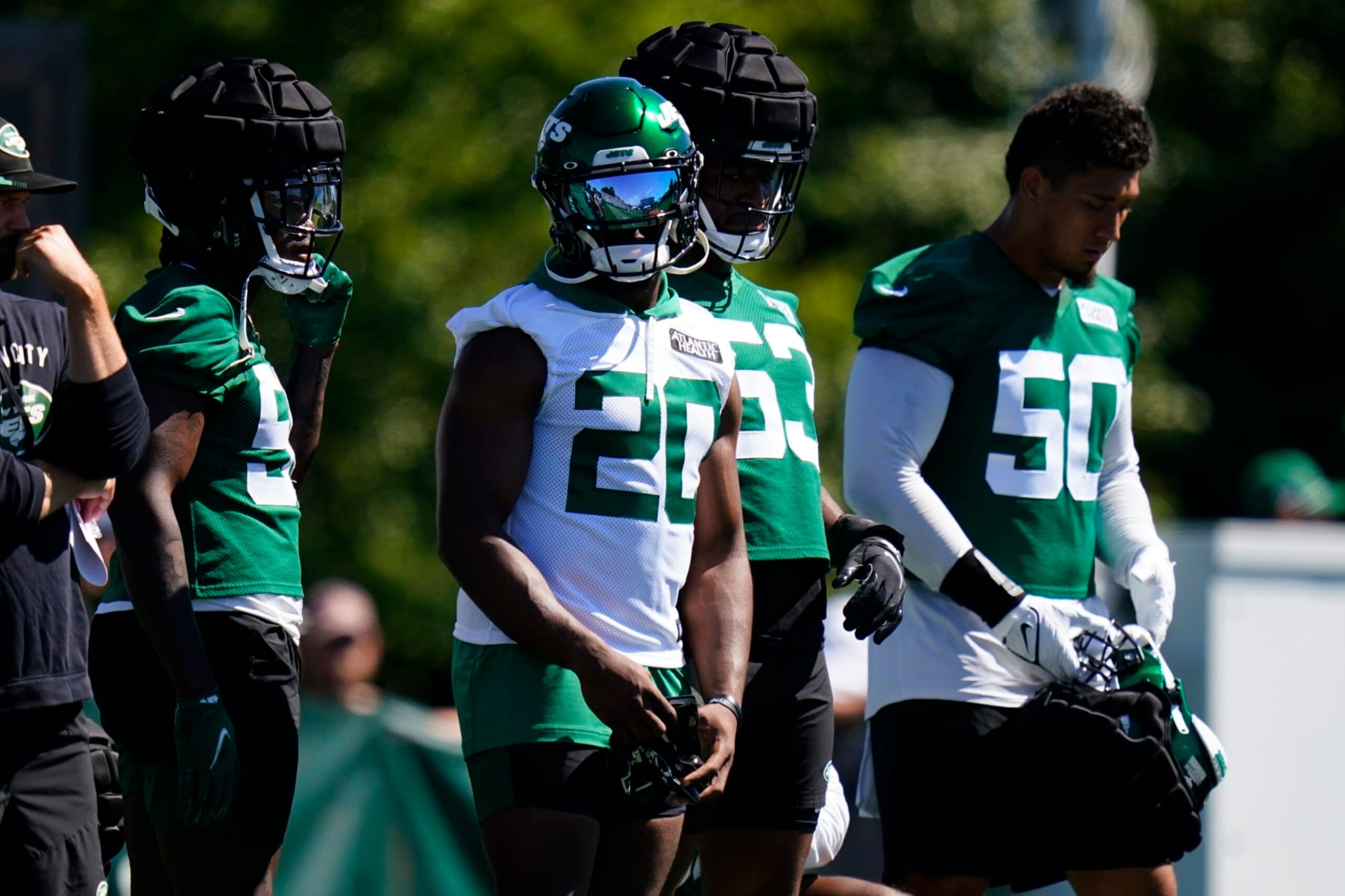 New York Jets' Breece Hall (20) stands with teammates during drills at the NFL football team's practice facility Saturday, July 30, 2022, in Florham Park, N.J. (AP Photo/Frank Franklin II)