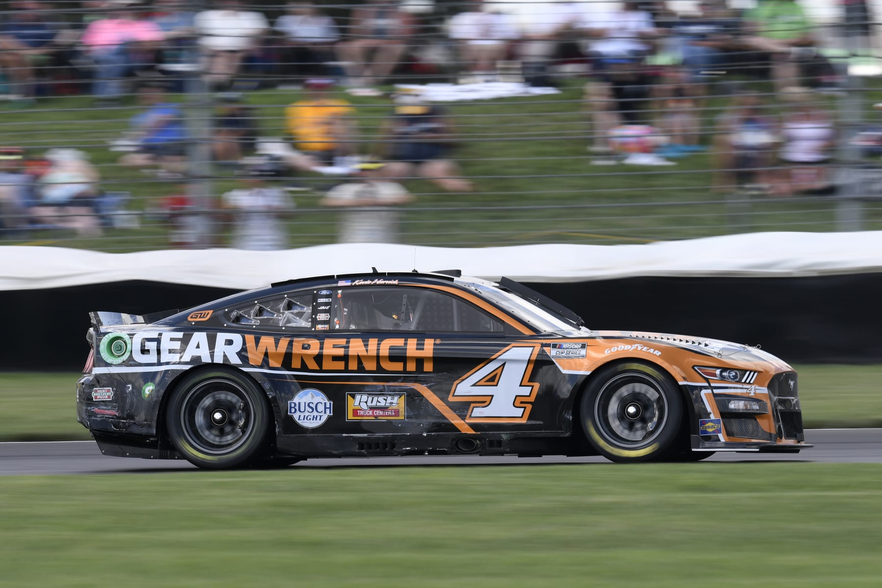 INDIANAPOLIS, IN - JULY 31: Kevin Harvick (#4 Stewart Haas Racing GEARWRENCH Ford) drives off of turn seven during the NASCAR Cup Series Verizon 200 at the Brickyard on July 31, 2022, at the Indianapolis Motor Speedway Road Course in Indianapolis, Indiana. (Photo by Michael Allio/Icon Sportswire via Getty Images)