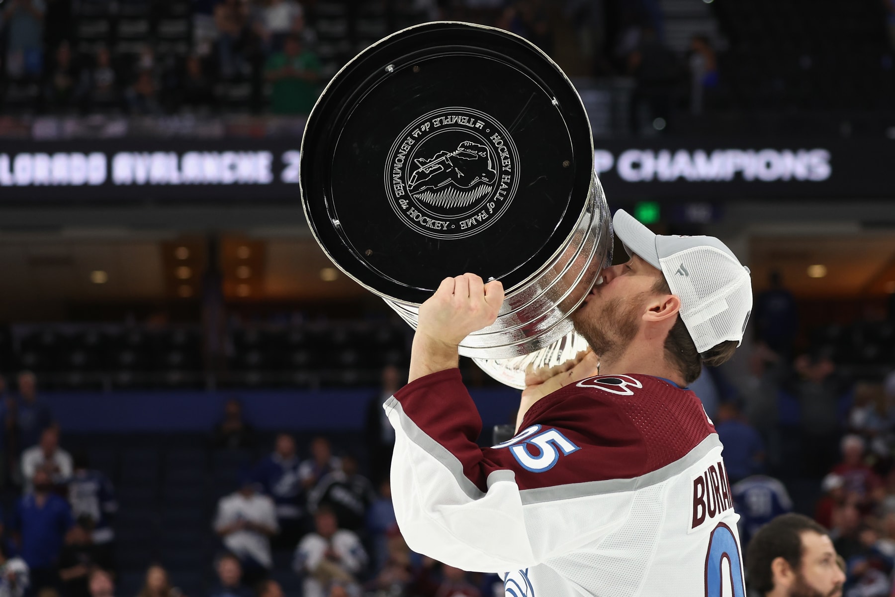 TAMPA, FLORIDA - JUNE 26:  Andre Burakovsky #95 of the Colorado Avalanche kisses the Stanley Cup in celebration after Game Six of the 2022 NHL Stanley Cup Final at Amalie Arena on June 26, 2022 in Tampa, Florida. The Avalanche defeated the Lightning 2-1.  (Photo by Christian Petersen/Getty Images)