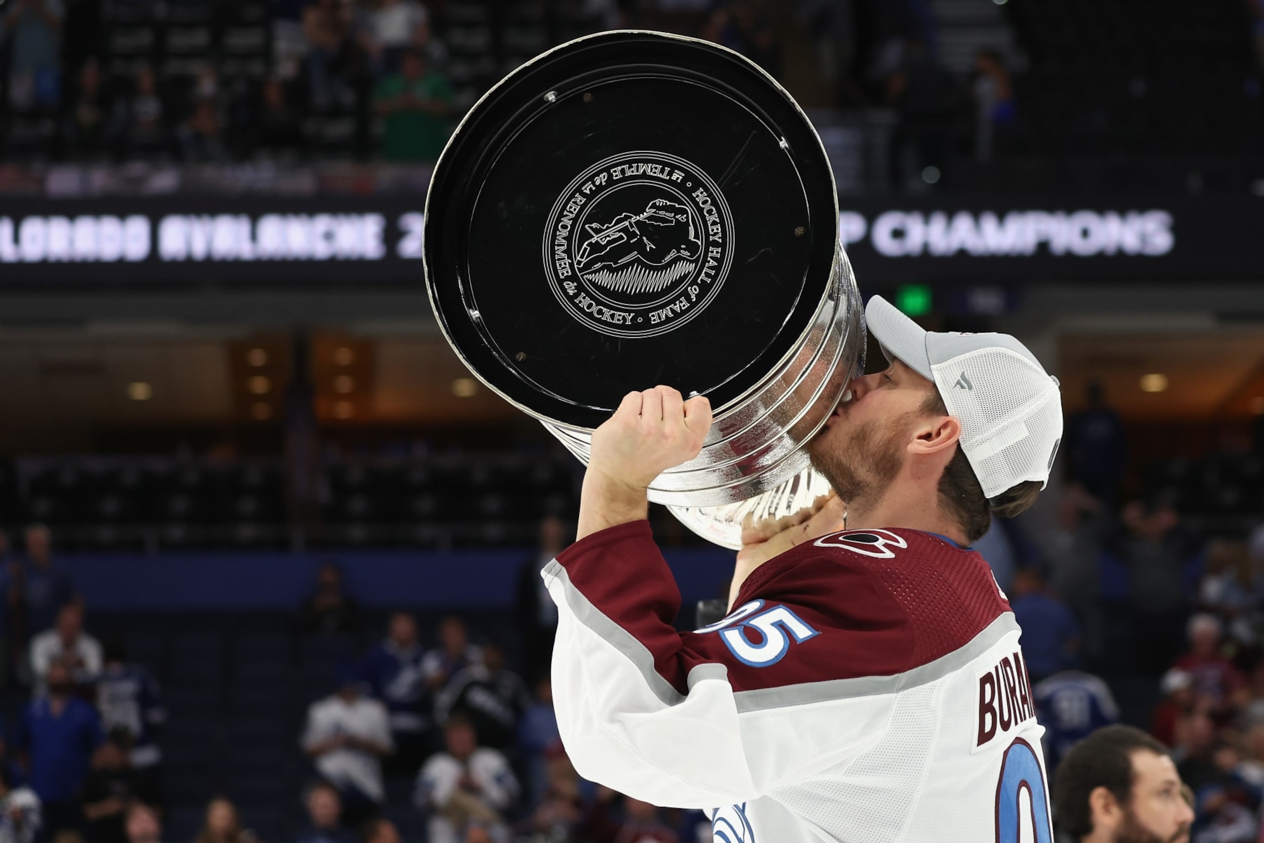 TAMPA, FLORIDA - JUNE 26:  Andre Burakovsky #95 of the Colorado Avalanche kisses the Stanley Cup in celebration after Game Six of the 2022 NHL Stanley Cup Final at Amalie Arena on June 26, 2022 in Tampa, Florida. The Avalanche defeated the Lightning 2-1.  (Photo by Christian Petersen/Getty Images)
