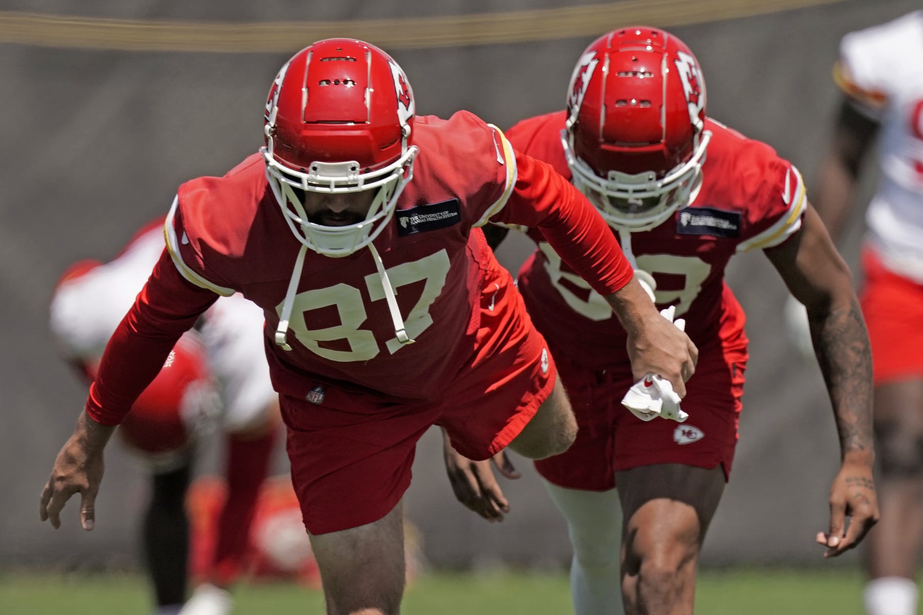 Kansas City Chiefs tight end Travis Kelce (87) stretches during the NFL football team's organized team activities Thursday, June 9, 2022, in Kansas City, Mo. (AP Photo/Charlie Riedel)