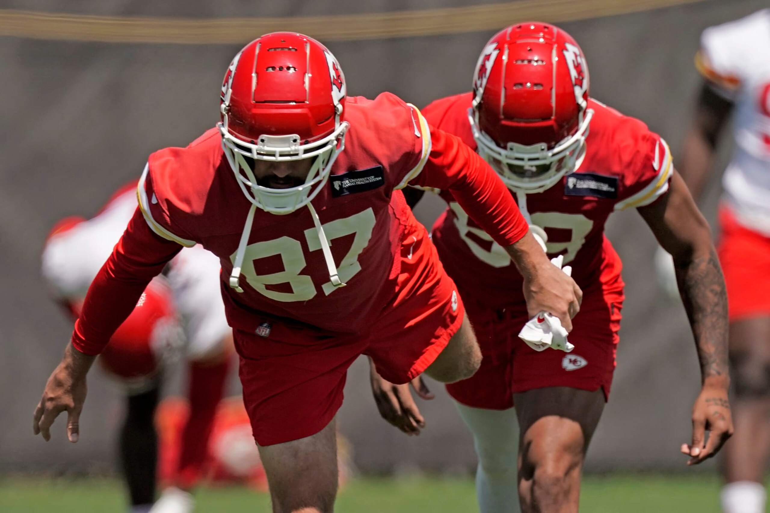 Kansas City Chiefs tight end Travis Kelce (87) stretches during the NFL football team's organized team activities Thursday, June 9, 2022, in Kansas City, Mo. (AP Photo/Charlie Riedel)