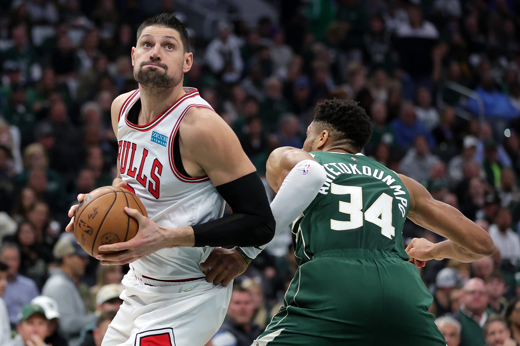 MILWAUKEE, WISCONSIN - APRIL 27: Nikola Vucevic #9 of the Chicago Bulls drives around Giannis Antetokounmpo #34 of the Milwaukee Bucks in the second quarter during Game Five of the Eastern Conference First Round Playoffs at Fiserv Forum on April 27, 2022 in Milwaukee, Wisconsin. NOTE TO USER: User expressly acknowledges and agrees that, by downloading and or using this photograph, User is consenting to the terms and conditions of the Getty Images License Agreement. (Photo by Stacy Revere/Getty Images)