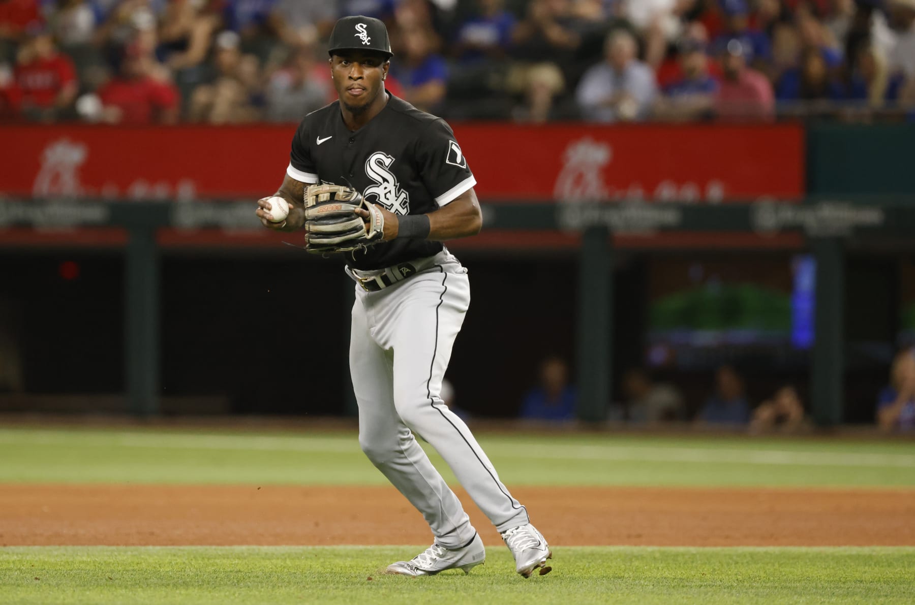 ARLINGTON, TX - AUGUST 4: Tim Anderson #7 of the Chicago White Sox looks to throw the ball against the Texas Rangers at Globe Life Field on August 4, 2022 in Arlington, Texas. (Photo by Ron Jenkins/Getty Images)