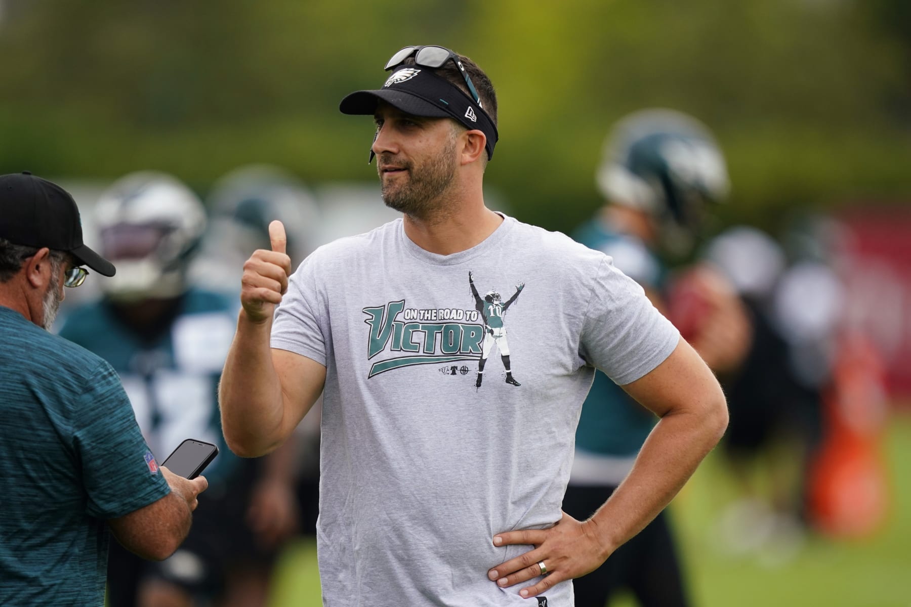 Philadelphia Eagles head coach Nick Sirianni reacts to fans during training camp at the NFL football team's practice facility, Friday, July 29, 2022, in Philadelphia. (AP Photo/Matt Slocum)