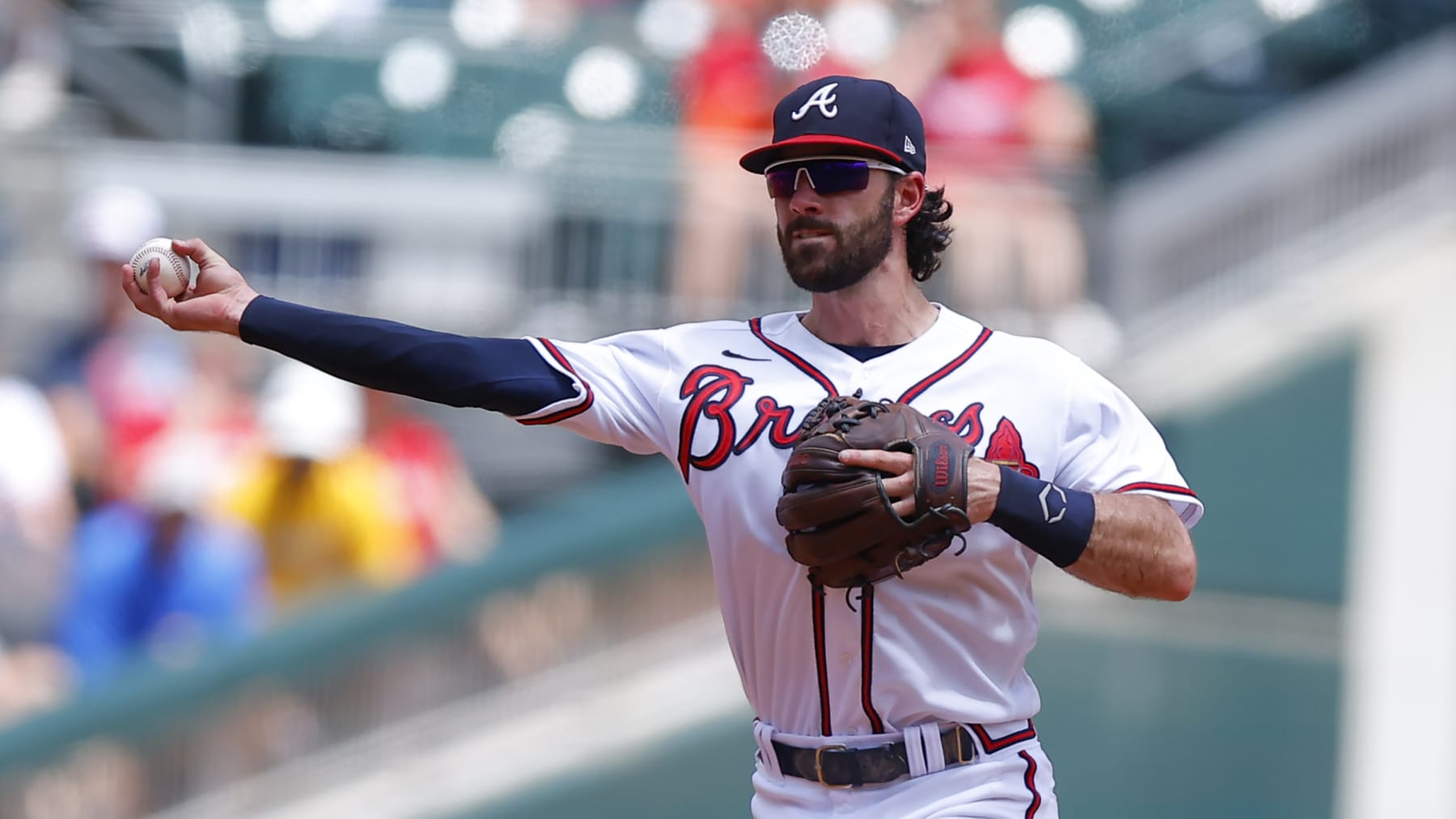 ATLANTA, GA - JULY 31: Dansby Swanson #7 of the Atlanta Braves throws to first during the fourth inning against the Arizona Diamondbacks at Truist Park on July 31, 2022 in Atlanta, Georgia. (Photo by Todd Kirkland/Getty Images)