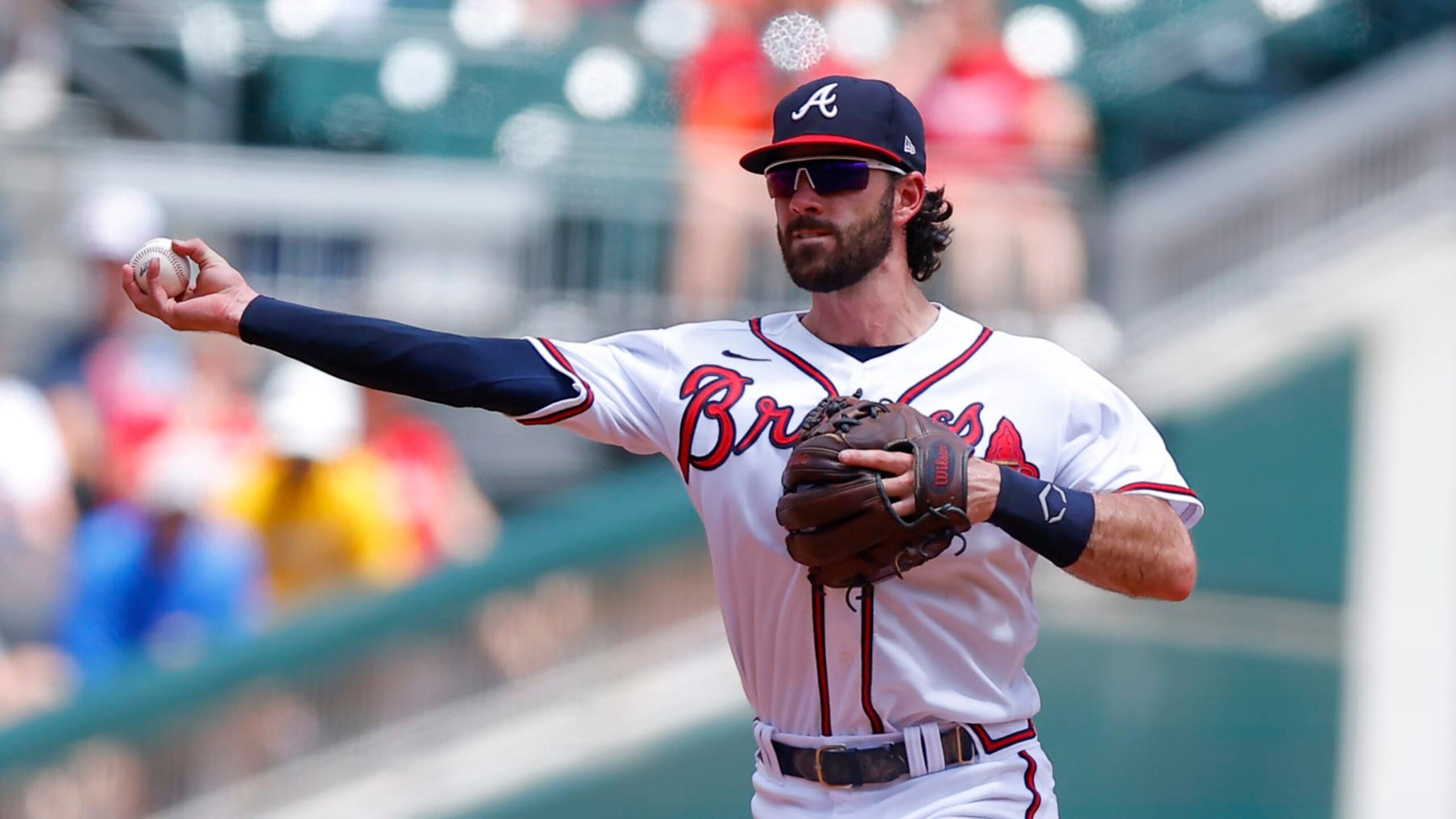 ATLANTA, GA - JULY 31: Dansby Swanson #7 of the Atlanta Braves throws to first during the fourth inning against the Arizona Diamondbacks at Truist Park on July 31, 2022 in Atlanta, Georgia. (Photo by Todd Kirkland/Getty Images)