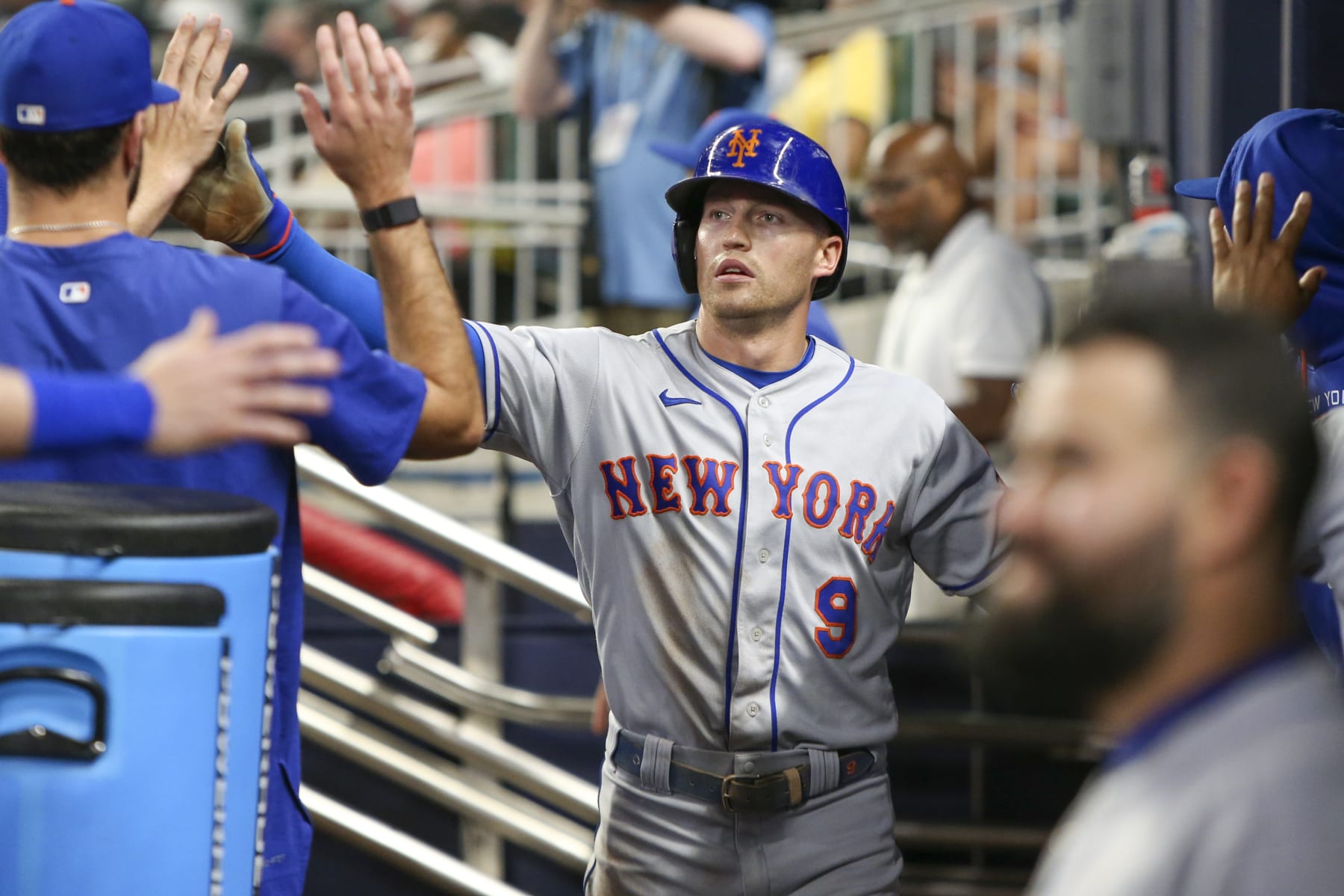 ATLANTA, GA - JULY 11: Brandon Nimmo #9 of the New York Mets celebrates with teammates after scoring against the Atlanta Braves in the ninth inning at Truist Park on July 11, 2022 in Atlanta, Georgia. (Photo by Brett Davis/Getty Images)