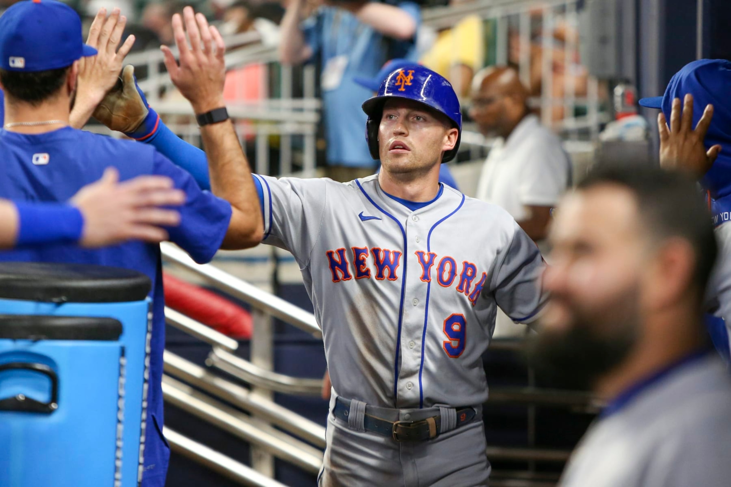 ATLANTA, GA - JULY 11: Brandon Nimmo #9 of the New York Mets celebrates with teammates after scoring against the Atlanta Braves in the ninth inning at Truist Park on July 11, 2022 in Atlanta, Georgia. (Photo by Brett Davis/Getty Images)
