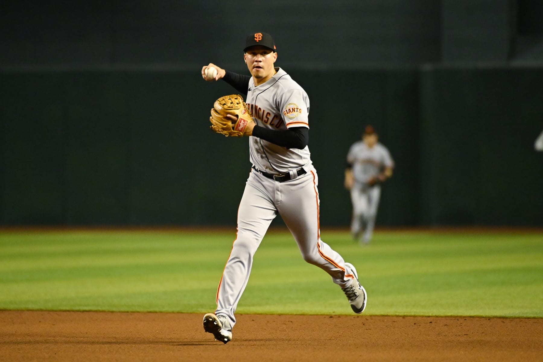 PHOENIX, ARIZONA - JULY 25: Wilmer Flores #41 of the San Francisco Giants throws the ball to first during the eighth inning of the MLB game at Chase Field on July 25, 2022 in Phoenix, Arizona. The Diamondbacks defeated the Giants 7-0. (Photo by Kelsey Grant/Getty Images)