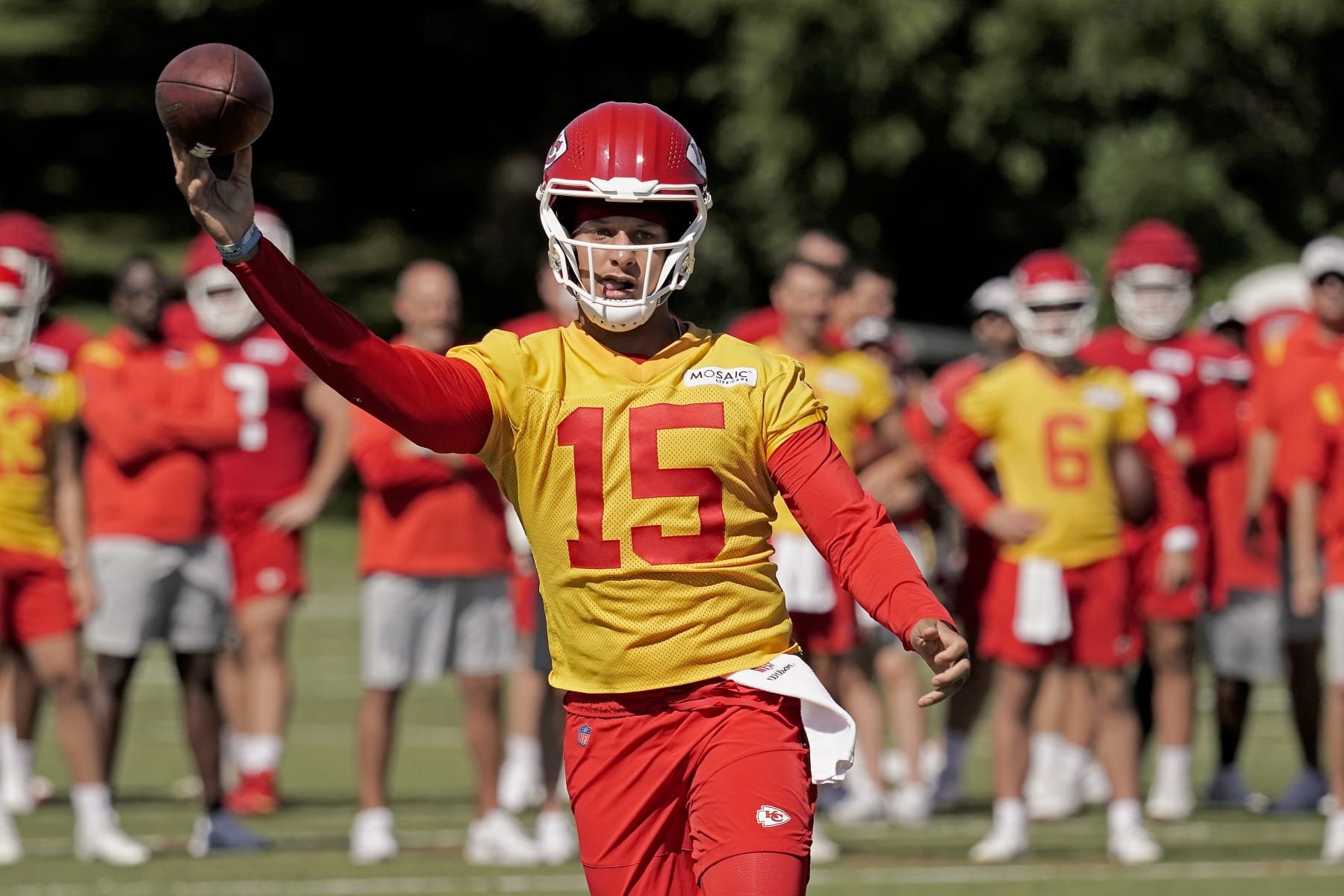 Kansas City Chiefs quarterback Patrick Mahomes throws during NFL football training camp Saturday, July 30, 2022, in St. Joseph, Mo. (AP Photo/Charlie Riedel)