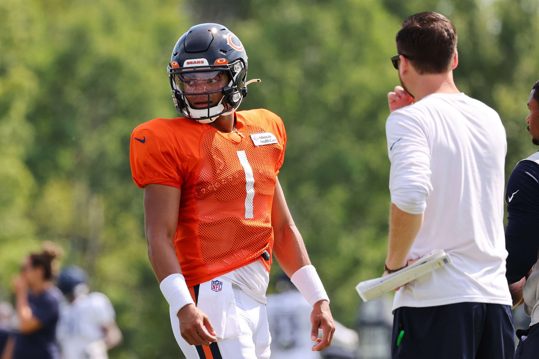LAKE FOREST, ILLINOIS - AUGUST 02: Justin Fields #1 of the Chicago Bears looks on during training camp at the PNC Center at Halas Hall on August 02, 2022 in Lake Forest, Illinois. (Photo by Michael Reaves/Getty Images)
