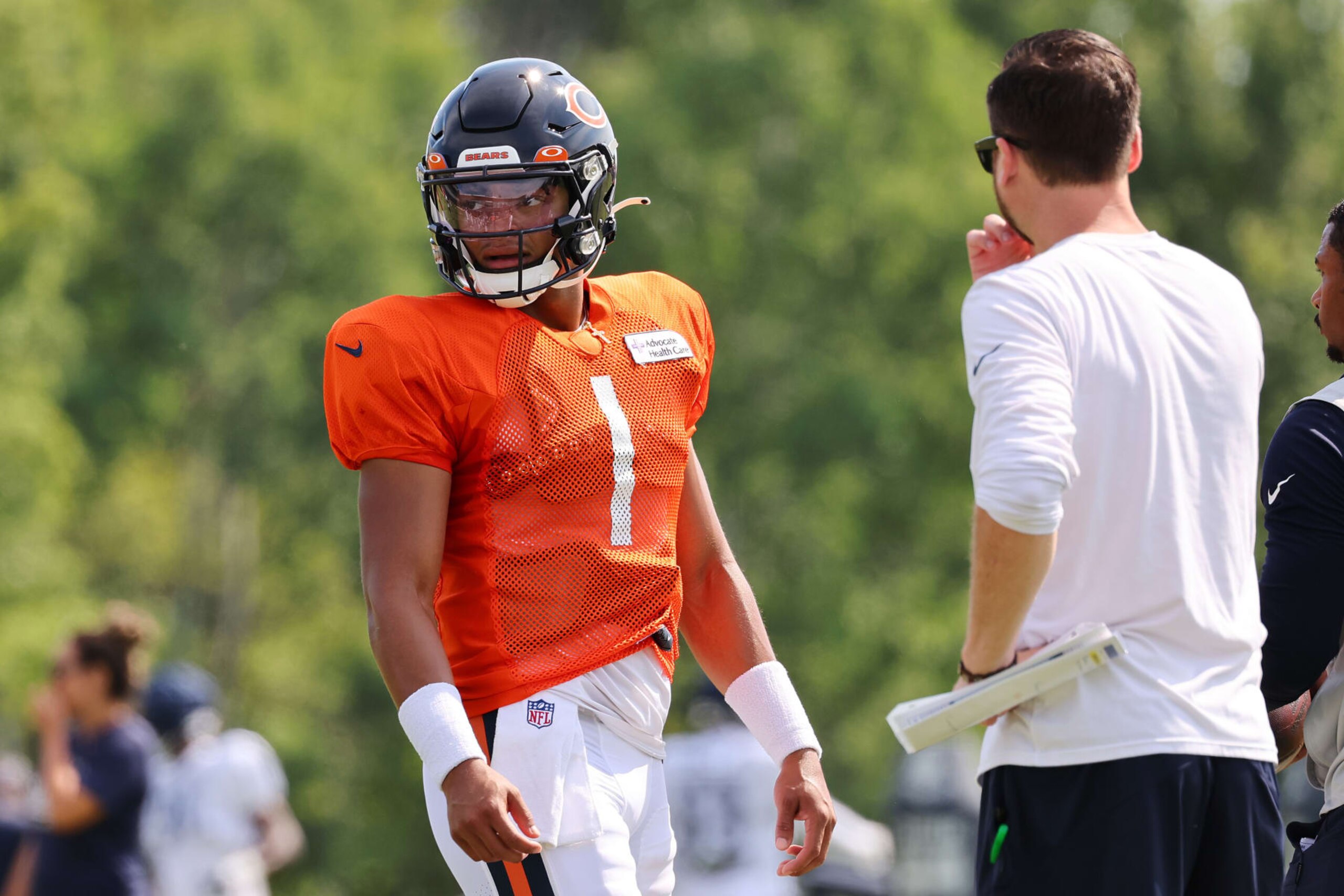LAKE FOREST, ILLINOIS - AUGUST 02: Justin Fields #1 of the Chicago Bears looks on during training camp at the PNC Center at Halas Hall on August 02, 2022 in Lake Forest, Illinois. (Photo by Michael Reaves/Getty Images)