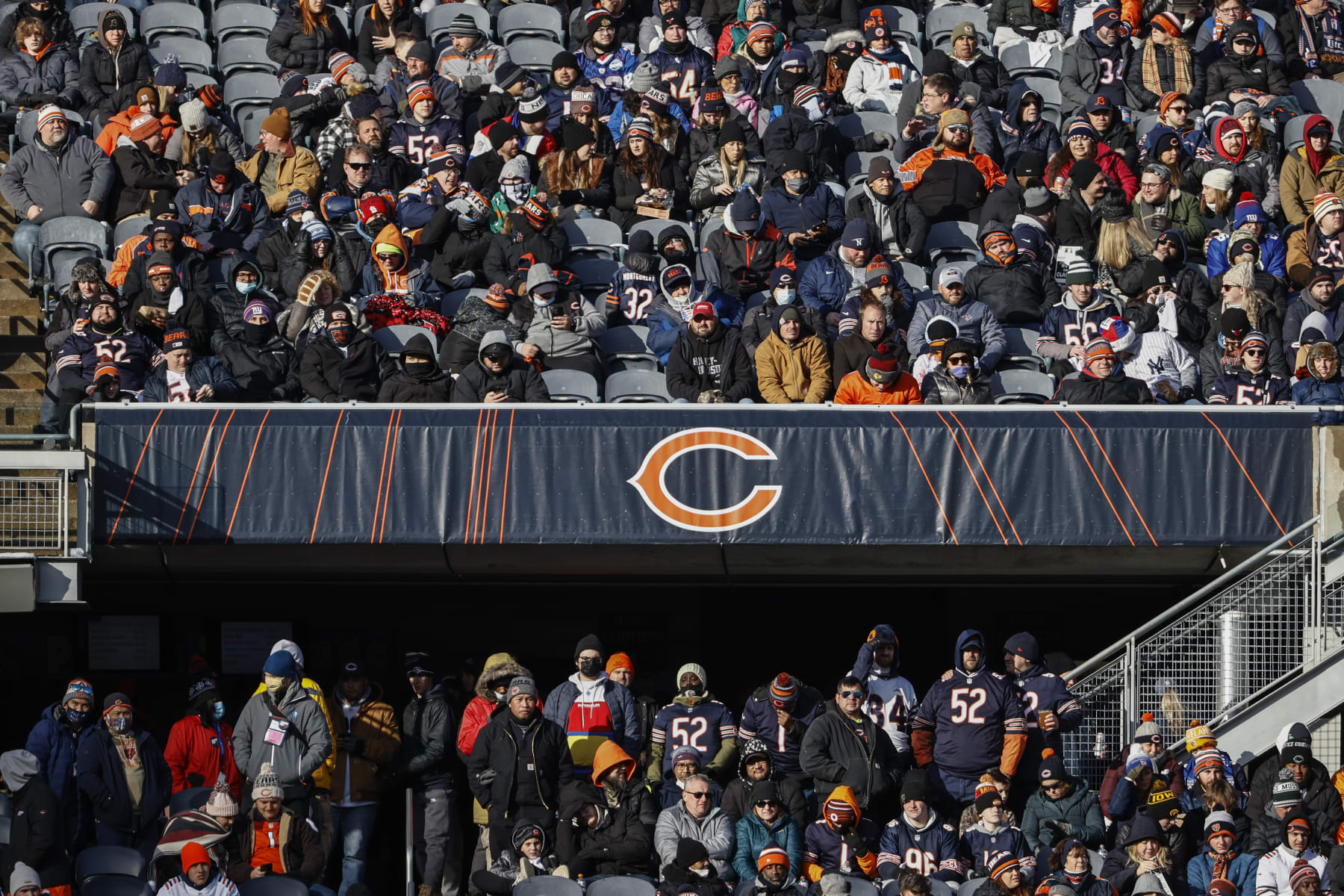 Fans watch the second half of an NFL football game between the Chicago Bears and New York Giants, Sunday, Jan. 2, 2022, in Chicago. (AP Photo/Kamil Krzaczynski)