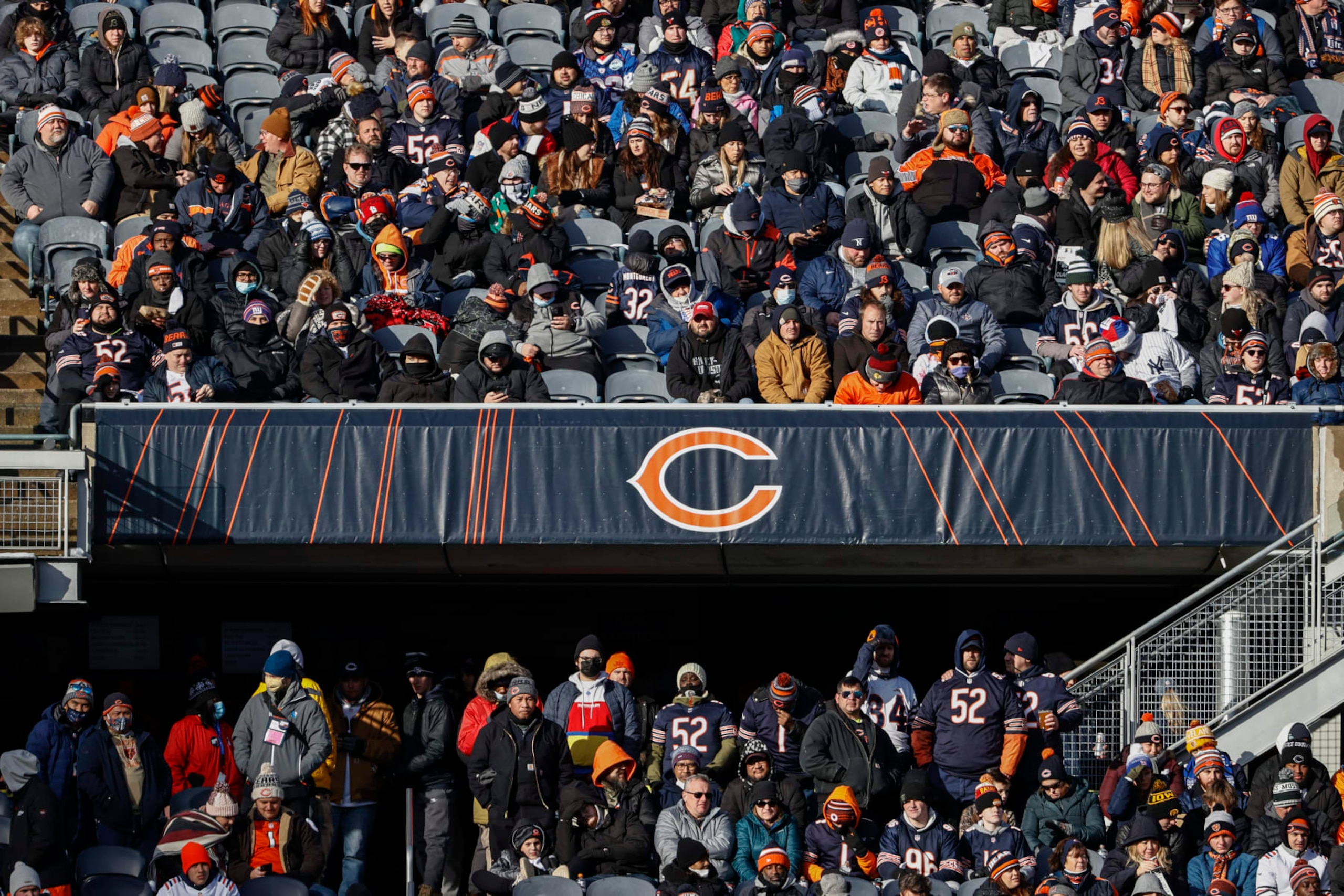 Fans watch the second half of an NFL football game between the Chicago Bears and New York Giants, Sunday, Jan. 2, 2022, in Chicago. (AP Photo/Kamil Krzaczynski)