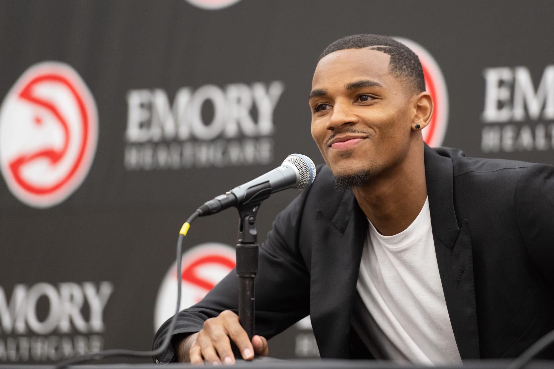 ATLANTA, GA - JULY 1: Dejounte Murray of the Atlanta Hawks talks to the media during the introductory draft press conference on July 1, 2022 at State Farm Arena in Atlanta, Georgia.  NOTE TO USER: User expressly acknowledges and agrees that, by downloading and/or using this Photograph, user is consenting to the terms and conditions of the Getty Images License Agreement. Mandatory Copyright Notice: Copyright 2022 NBAE (Photo by Adam Hagy/NBAE via Getty Images)