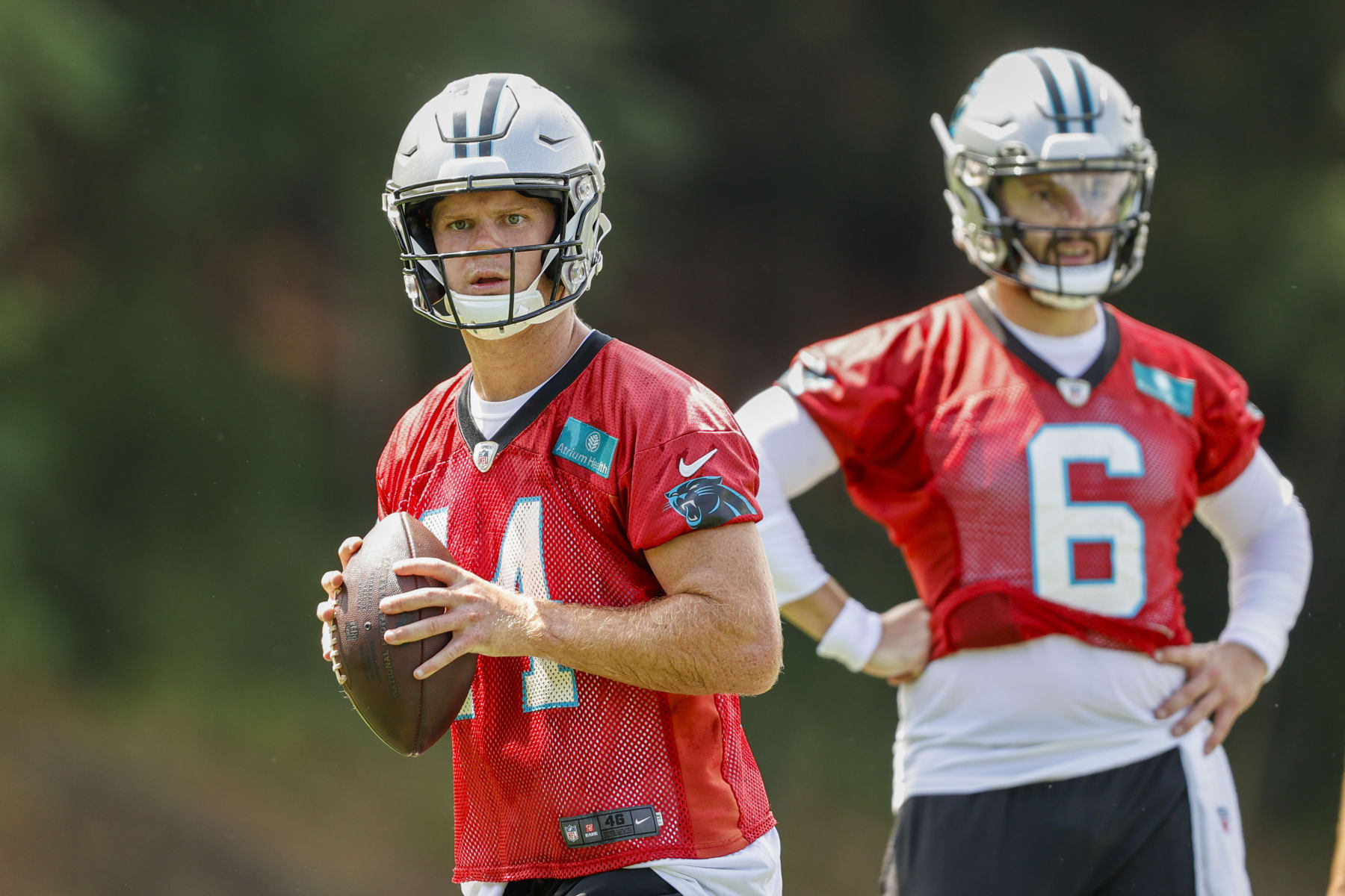 Carolina Panthers quarterback Sam Darnold, left, looks to throw as quarterback Baker Mayfield looks on during the NFL football team's training camp at Wofford College in Spartanburg, S.C., Wednesday, July 27, 2022. (AP Photo/Nell Redmond) Carolina Panthers quarterback Sam Darnold, left, looks to throw as quarterback Baker Mayfield looks on during the NFL football team's training camp at Wofford College in Spartanburg, S.C., Wednesday, July 27, 2022. (AP Photo/Nell Redmond)