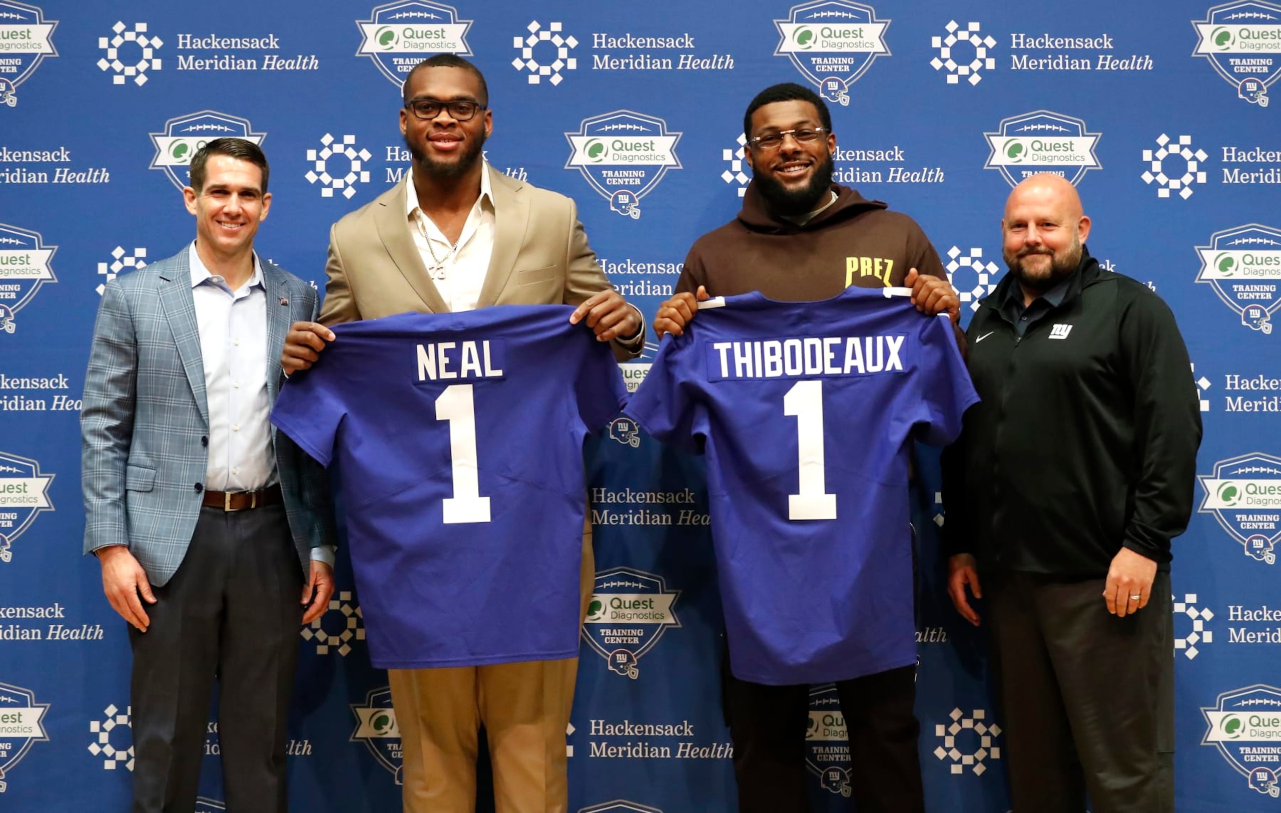 New York Giants general manager Joe Schoen, left, and head coach Brian Daboll, right, introduce NFL football draft picks Evan Neal and Kayvon Thibodeaux, during a press conference in East Rutherford, N.J. on Saturday, April 30, 2022. (AP Photo/Noah K. Murray) New York Giants general manager Joe Schoen, left, and head coach Brian Daboll, right, introduce NFL football draft picks Evan Neal and Kayvon Thibodeaux, during a press conference in East Rutherford, N.J. on Saturday, April 30, 2022. (AP Photo/Noah K. Murray)