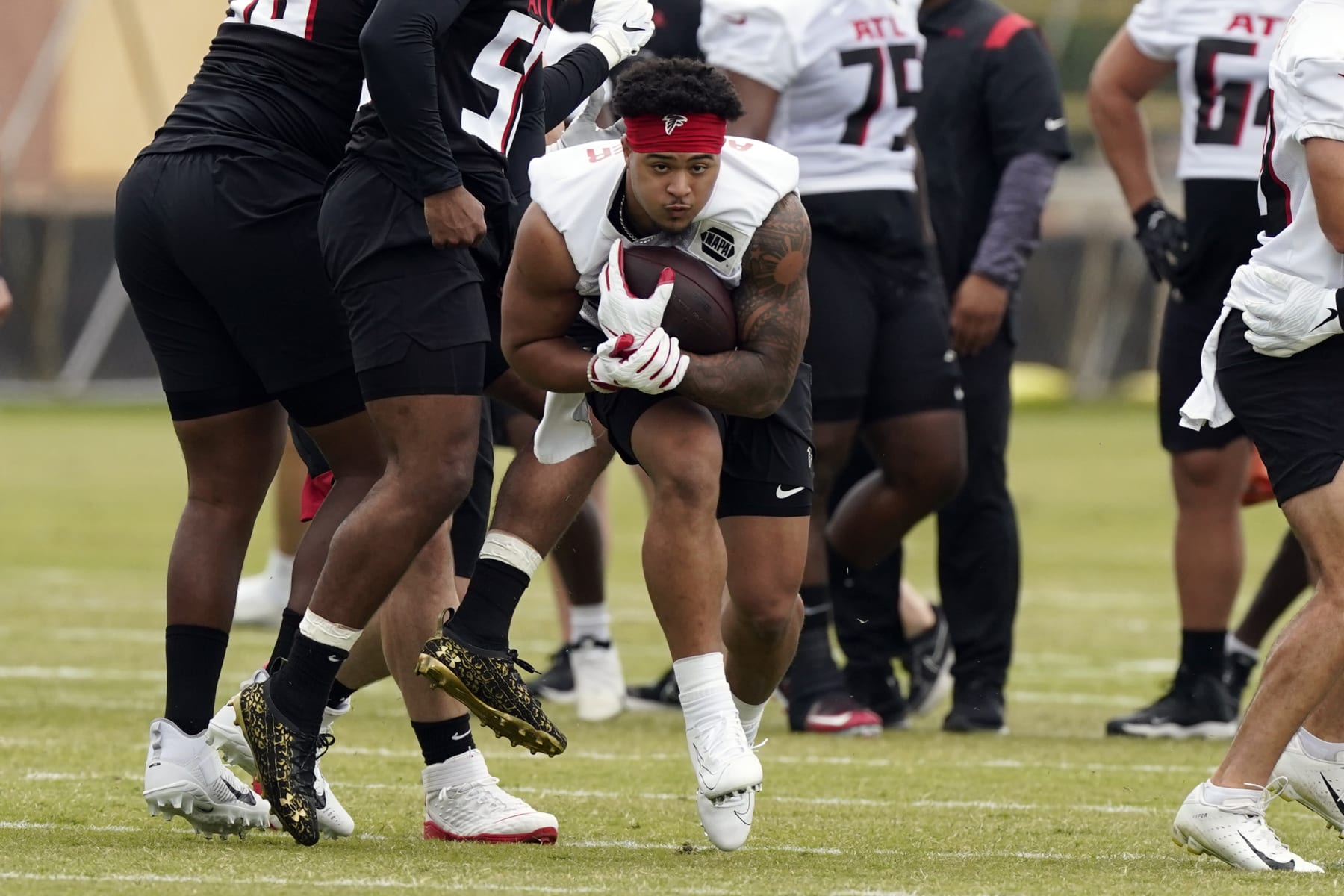 Atlanta Falcons running back Tyler Allgeier (25) is shown during their NFL rookie minicamp football practice Friday, May 13, 2022, in Flowery Branch, Ga. (AP Photo/John Bazemore)