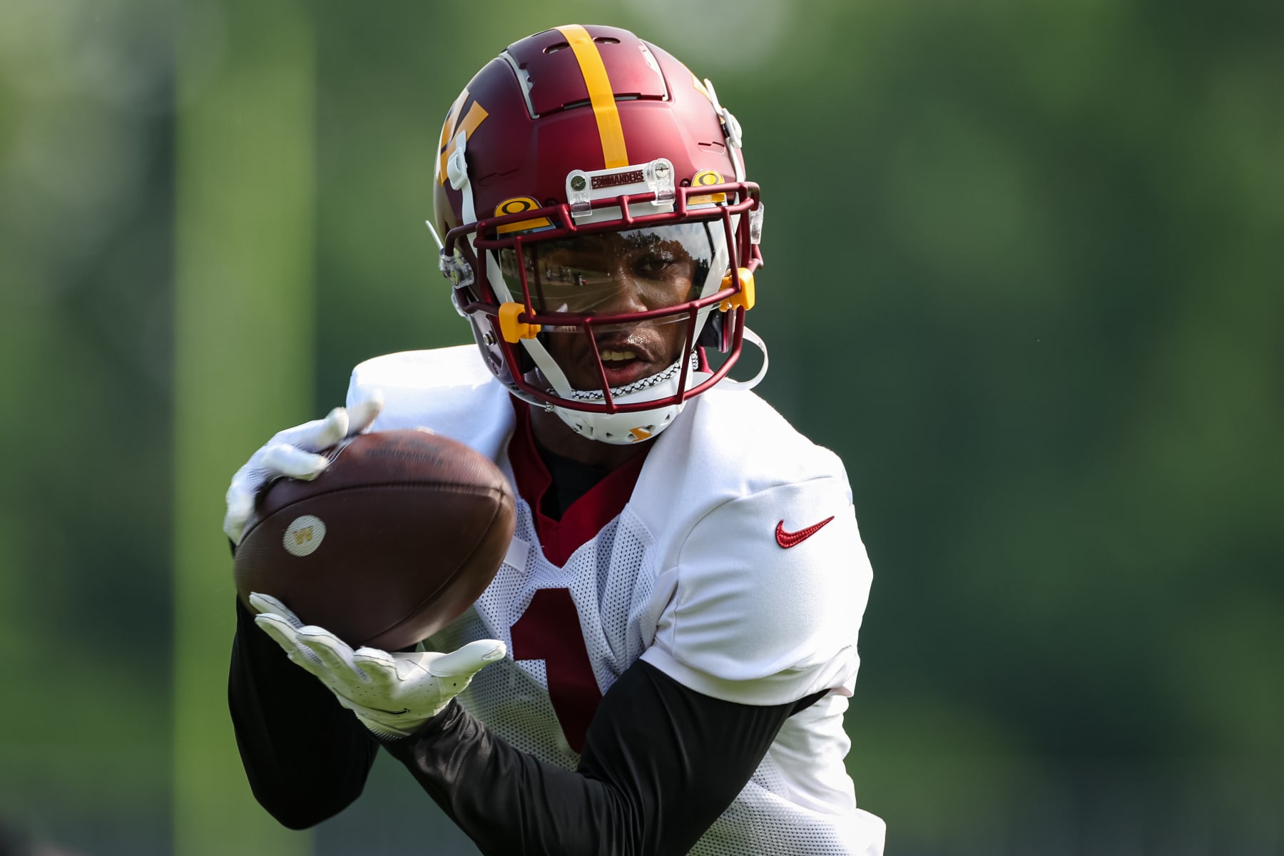 ASHBURN, VA - JUNE 16: Jahan Dotson #1 of the Washington Commanders makes a catch during the organized team activity at INOVA Sports Performance Center on June 16, 2022 in Ashburn, Virginia. (Photo by Scott Taetsch/Getty Images)