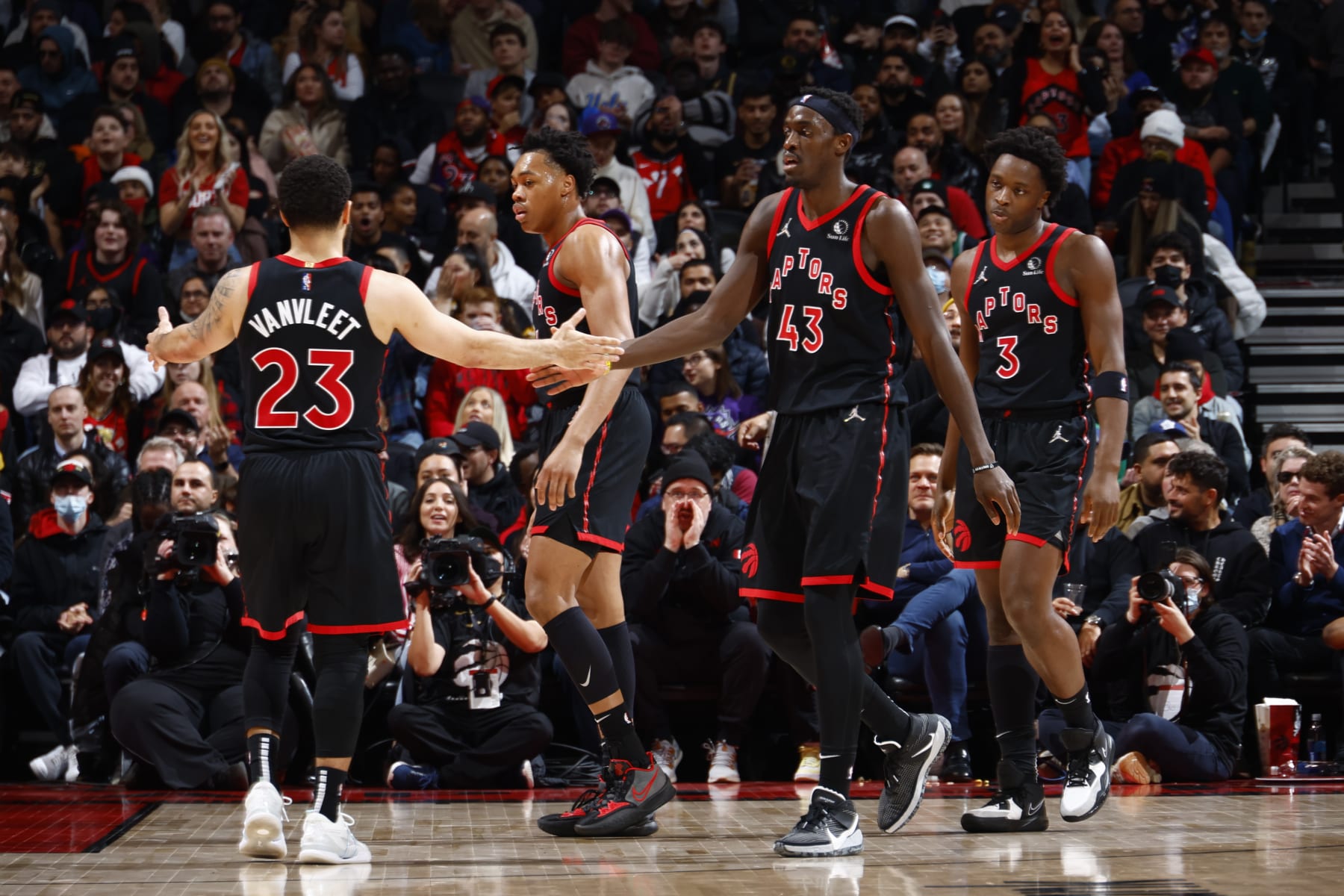 TORONTO, CANADA - MARCH 28: Fred VanVleet #23 of the Toronto Raptors high fives Pascal Siakam #43 of the Toronto Raptors during the game against the Boston Celtics on March 28, 2022 at the Scotiabank Arena in Toronto, Ontario, Canada.  NOTE TO USER: User expressly acknowledges and agrees that, by downloading and or using this Photograph, user is consenting to the terms and conditions of the Getty Images License Agreement.  Mandatory Copyright Notice: Copyright 2022 NBAE (Photo by Vaughn Ridley/NBAE via Getty Images)