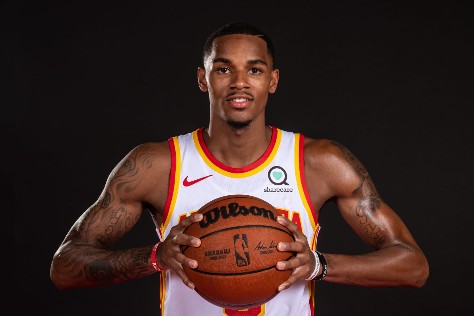 ATLANTA, GA - JULY 1: Dejounte Murray poses for a portrait after the introductory draft press conference on July 1, 2022 at State Farm Arena in Atlanta, Georgia.  NOTE TO USER: User expressly acknowledges and agrees that, by downloading and/or using this Photograph, user is consenting to the terms and conditions of the Getty Images License Agreement. Mandatory Copyright Notice: Copyright 2022 NBAE (Photo by Adam Hagy/NBAE via Getty Images)