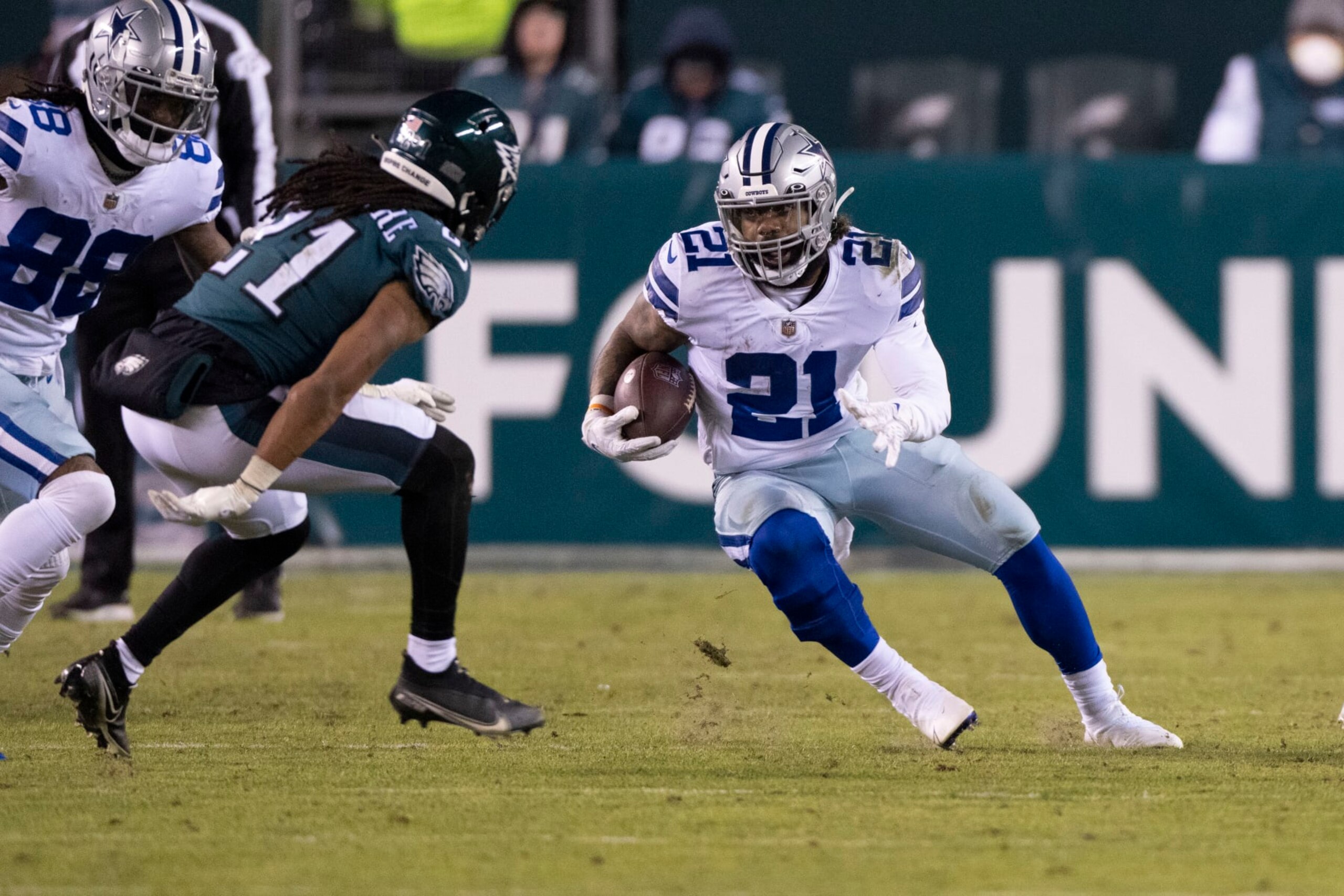 PHILADELPHIA, PA - JANUARY 08: Dallas Cowboys Running Back Ezekiel Elliott (21) runs with the ball with Philadelphia Eagles Defensive Back Andre Chachere (21) defending during the first half of the National Football League game between the Dallas Cowboys and the Philadelphia Eagles on January 8, 2021, at Lincoln Financial Field in Philadelphia, PA. (Photo by Gregory Fisher/Icon Sportswire via Getty Images)