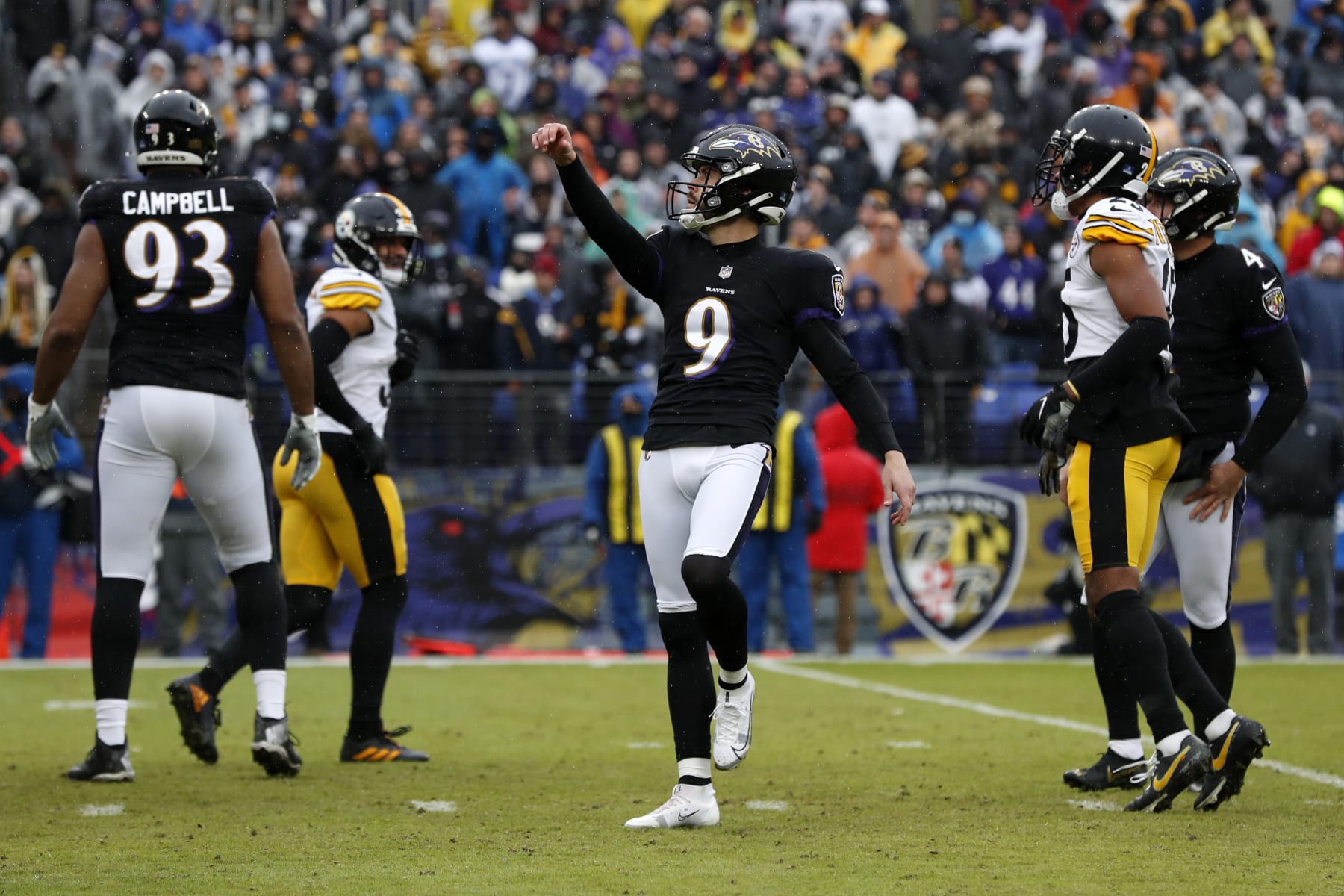 BALTIMORE, MARYLAND - JANUARY 09: Justin Tucker #9 of the Baltimore Ravens celebrates after a field goal during the second quarter in the game against the Pittsburgh Steelers at M&T Bank Stadium on January 09, 2022 in Baltimore, Maryland. (Photo by Todd Olszewski/Getty Images)