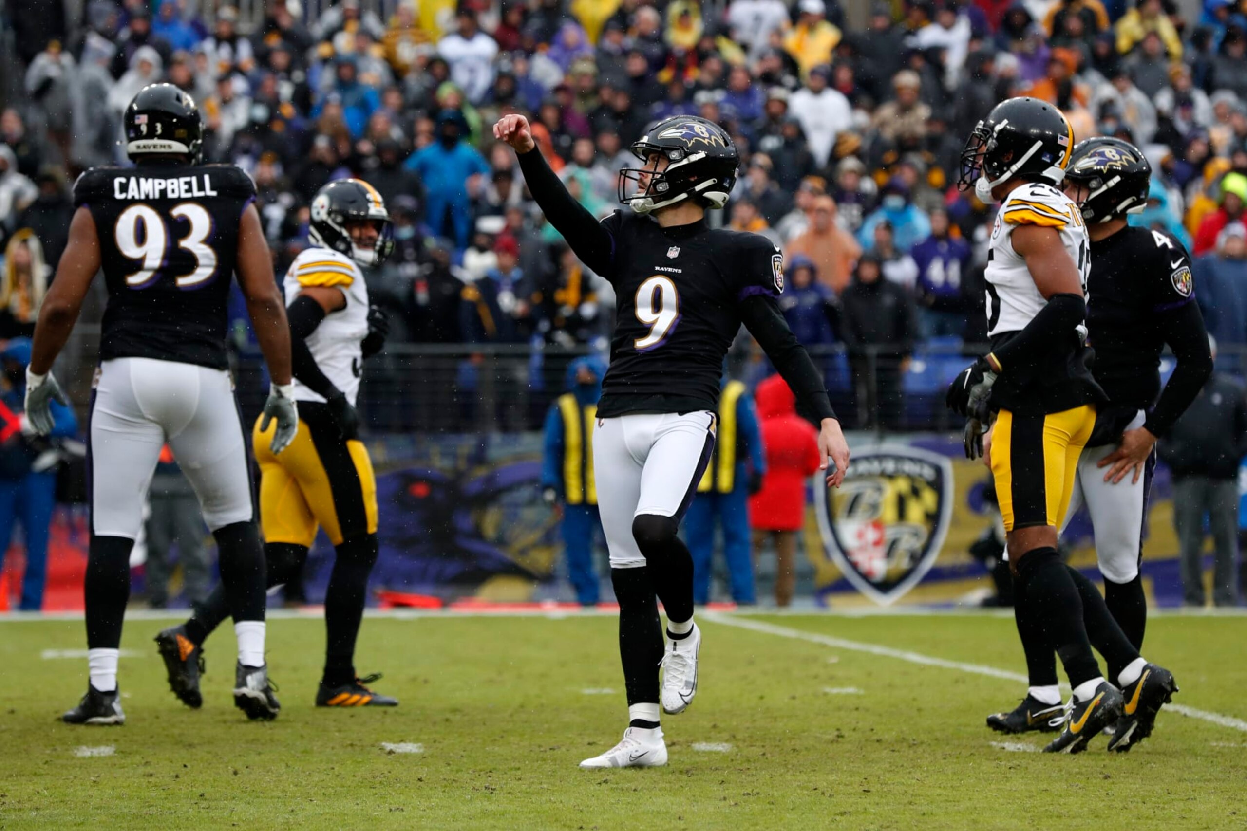 BALTIMORE, MARYLAND - JANUARY 09: Justin Tucker #9 of the Baltimore Ravens celebrates after a field goal during the second quarter in the game against the Pittsburgh Steelers at M&T Bank Stadium on January 09, 2022 in Baltimore, Maryland. (Photo by Todd Olszewski/Getty Images)